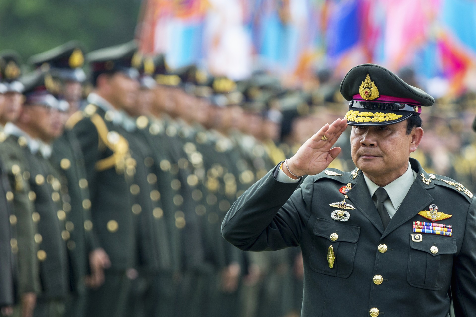 <p>Thailand’s Prime Minister Prayuth Chan-ocha salutes members of the Royal Thai Army after a handover ceremony for the new Royal Thai Army Chief, General Udomdej Sitabutr, at the Thai Army Headquarters in Bangkok on September 30, 2014.</p>