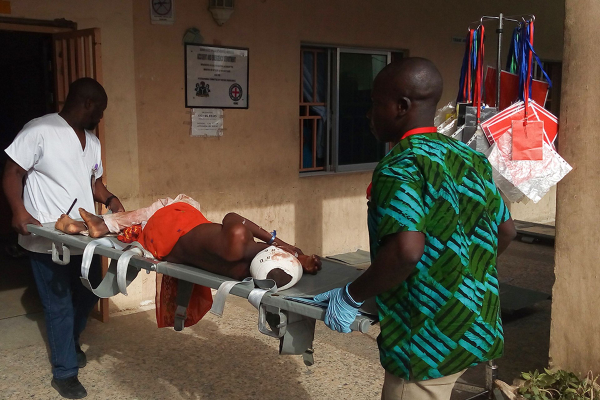 <p>Paramedics carry a stretcher with a victim of a blast on it at the hospital in Maiduguri on June 17, 2018.</p>