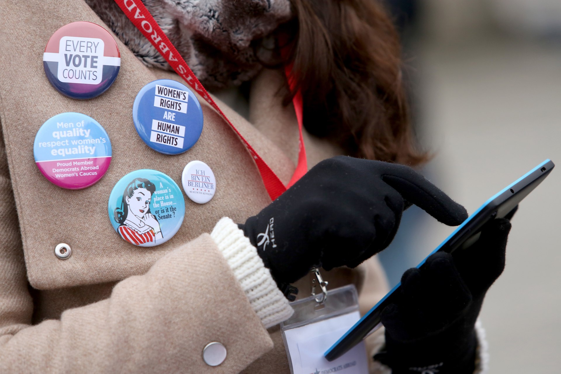 <p>An activist uses a mobile phone as she participates in a demonstration for women’s rights on January 21, 2018 in Berlin, Germany.</p>