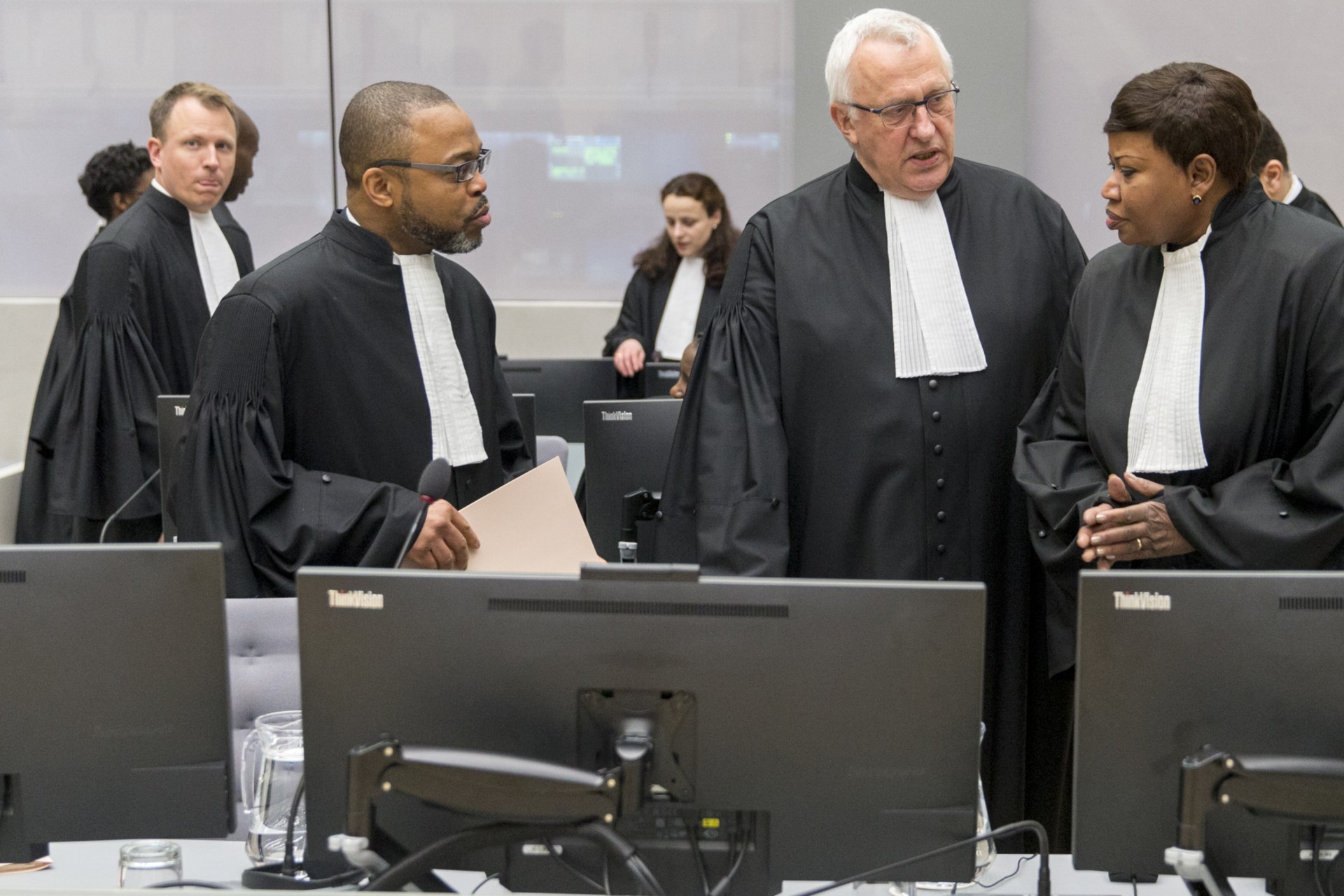 <p>Jean-Jacques Badibanga,  James Stewart, and Chief Prosecutor Fatou Bensouda are seen in a court room of the ICC before the delivery of the judgment in the case of Jean-Pierre Bemba in the Hague, 2016.</p>
