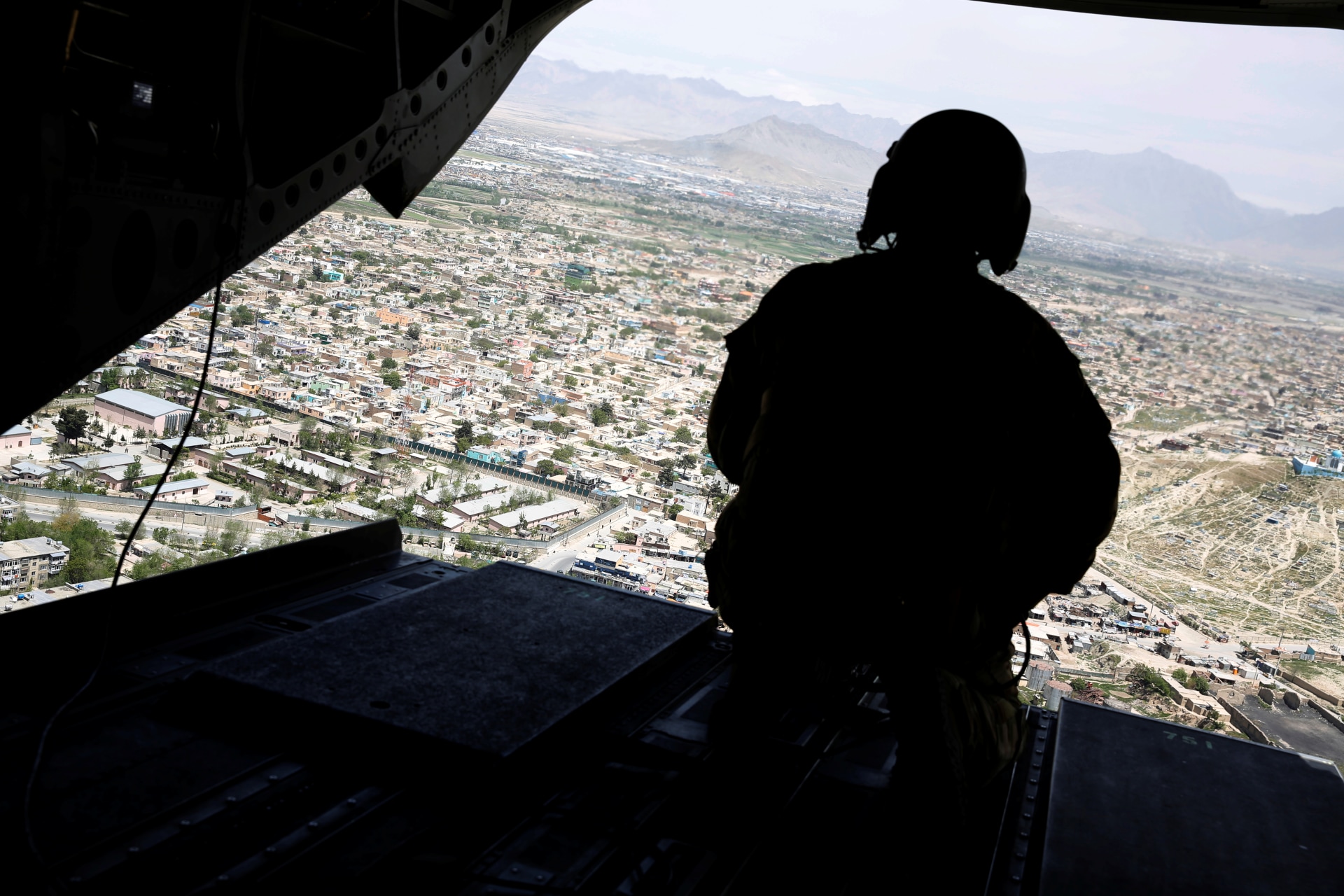 <p>A U.S. soldier mans a gun at the back gate aboard the helicopter carrying U.S. Defense Secretary James Mattis as he arrives via helicopter at Resolute Support headquarters in Kabul, Afghanistan, on April 24, 2017.</p>
