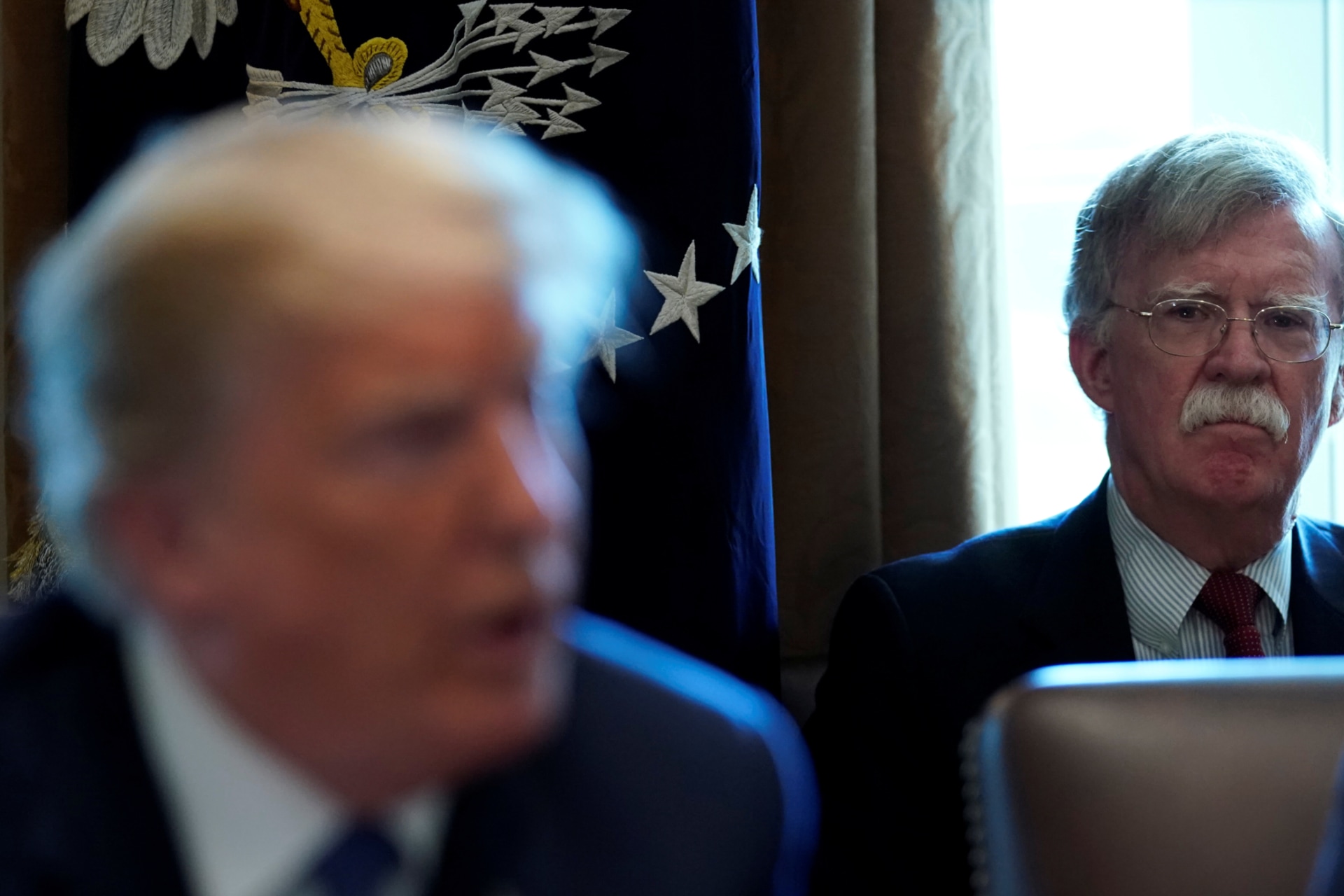 <p>New National Security Adviser John Bolton listens as U.S. President Donald Trump holds a cabinet meeting at the White House on April 9, 2018</p>
