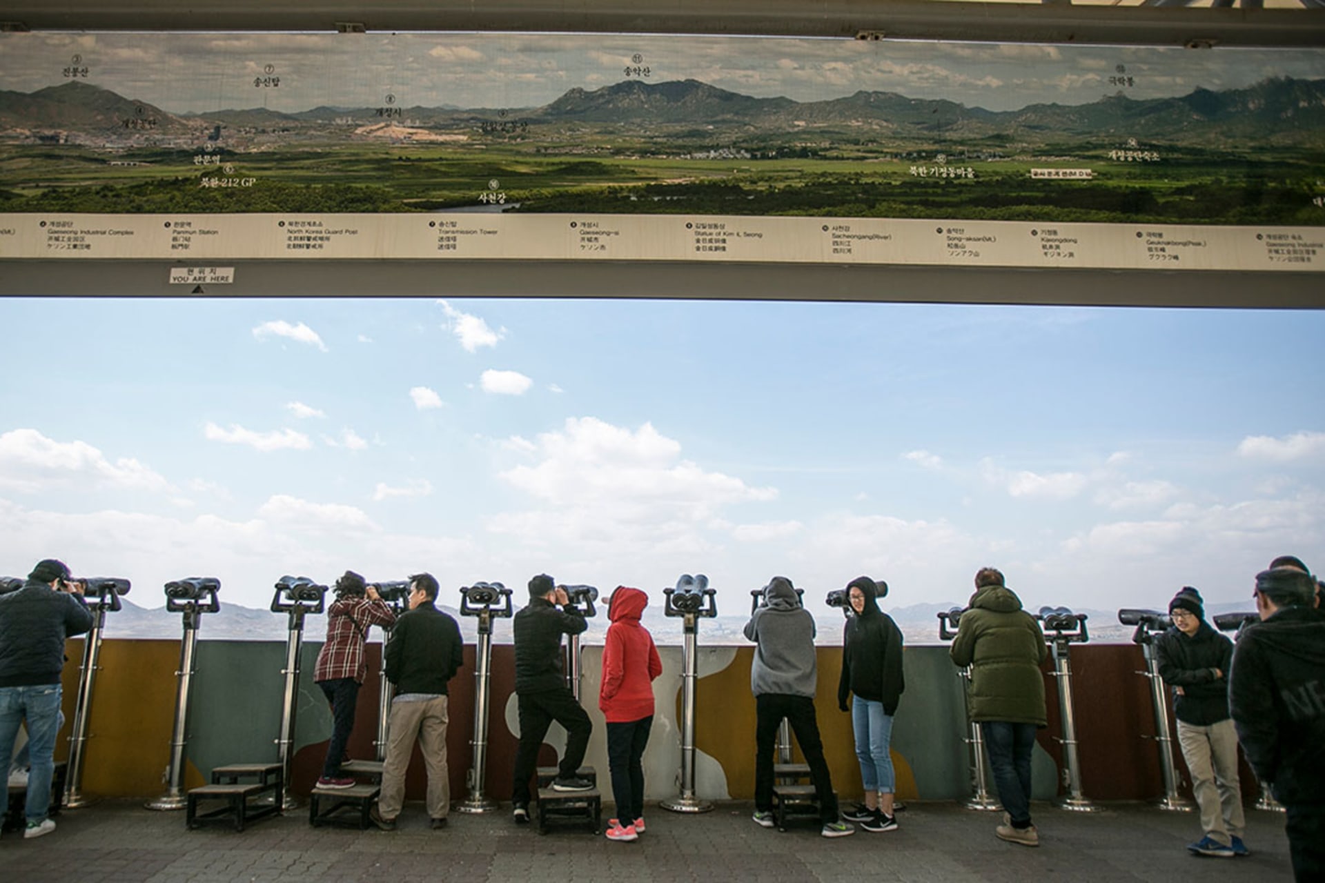 <p>Tourists look toward North Korea from the southern side of the demilitarized zone.</p>