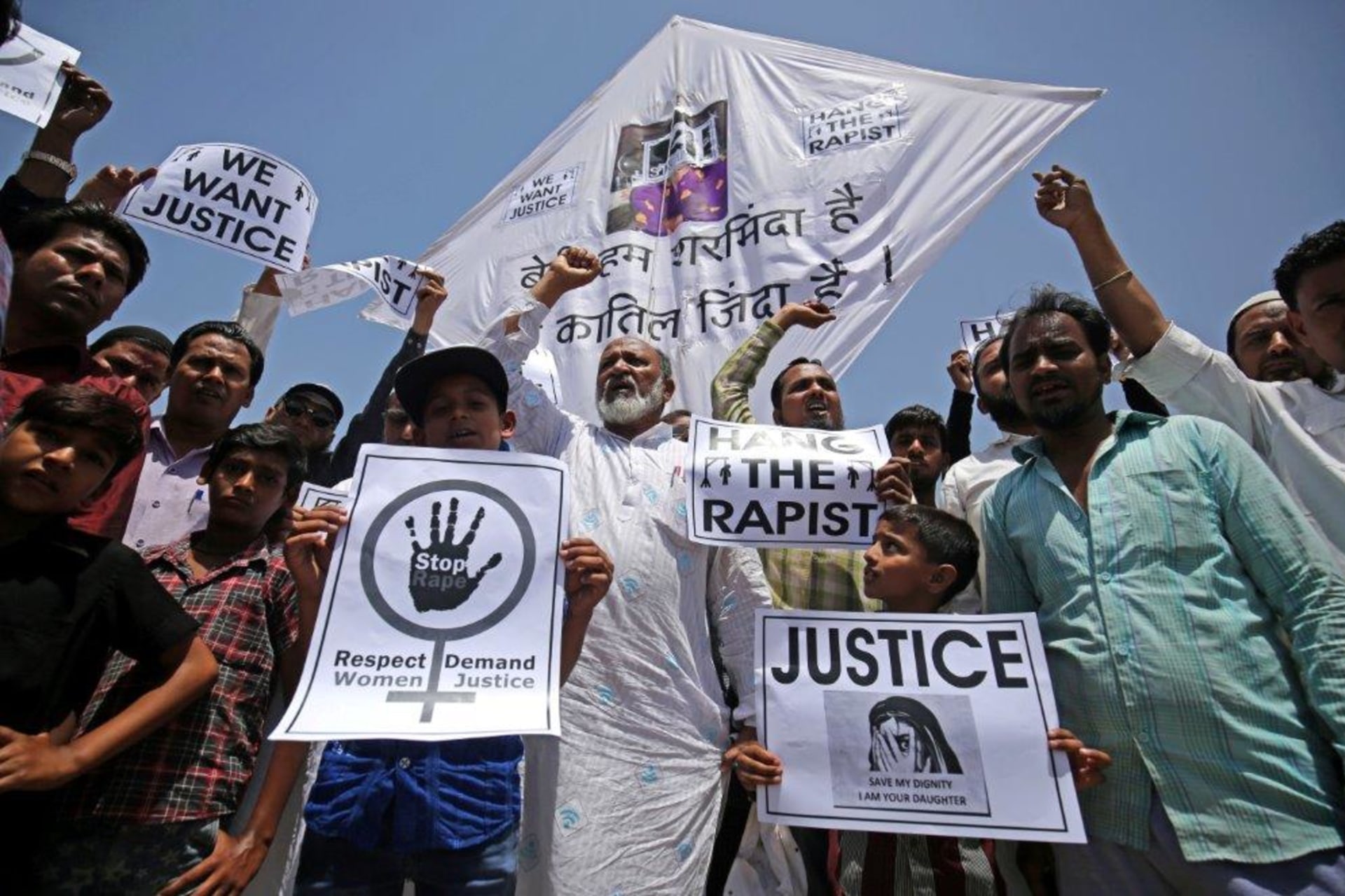 <p>People hold placards at a protest against the rape of an eight-year-old girl in Kathua, in Ahmedabad, India.</p>

