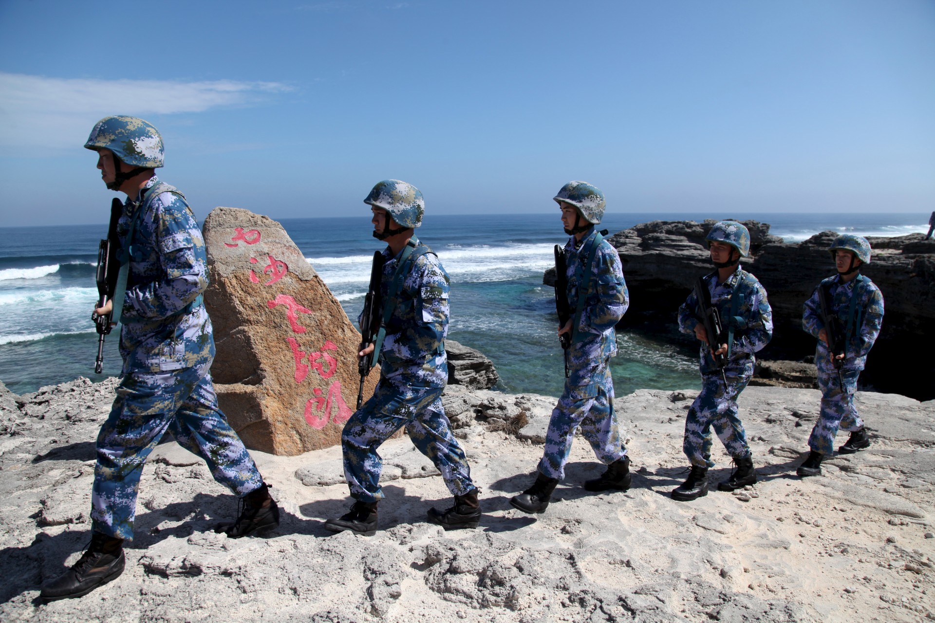 <p>Soldiers of China’s People’s Liberation Army (PLA) Navy patrol at Woody Island, in the Paracel Archipelago, which is known in China as the Xisha Islands. January 29, 2016.</p>