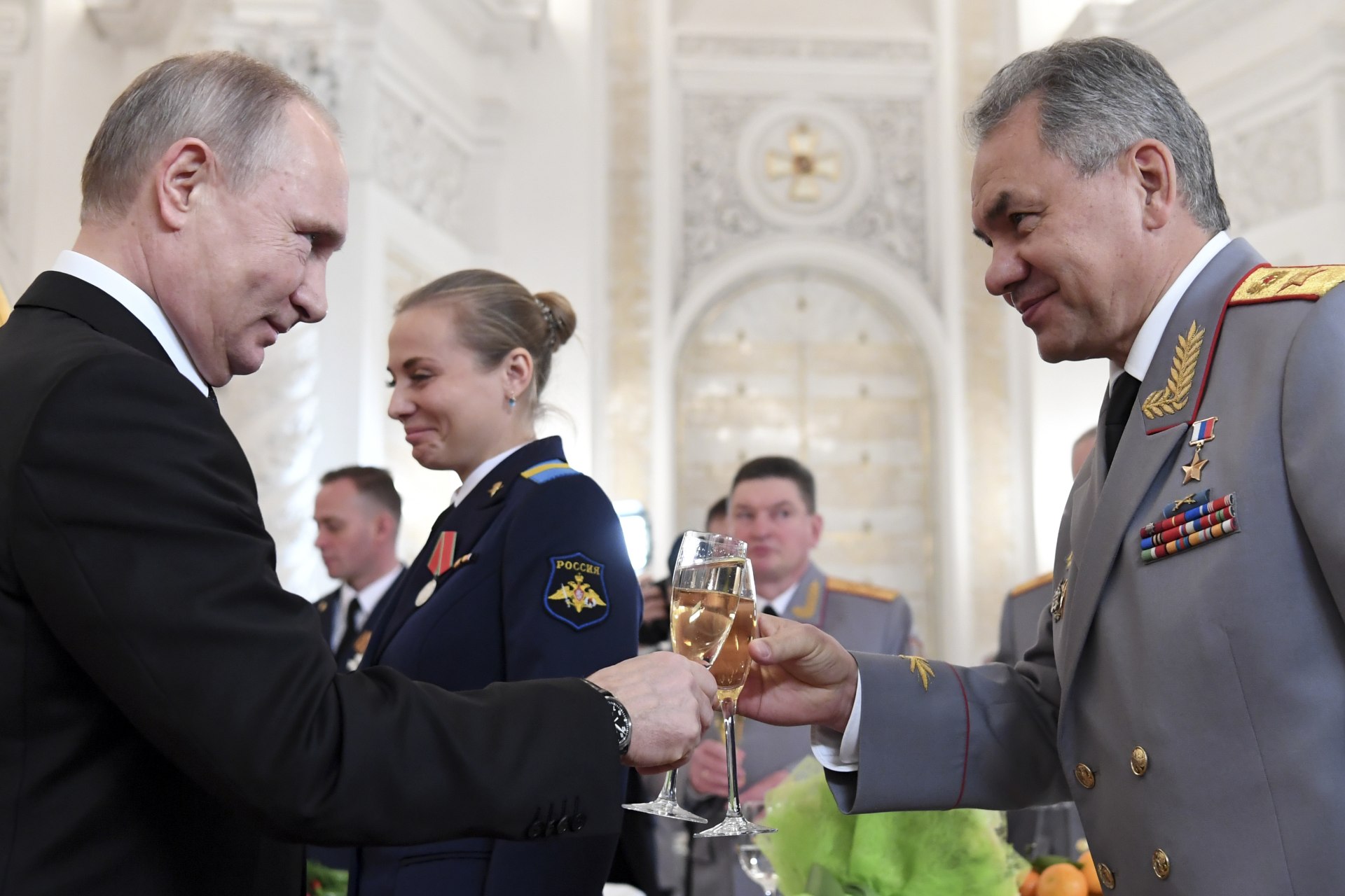 <p>Russian President Vladimir Putin toasts with Defence Minister Sergei Shoigu after a state awards ceremony for military personnel who served in Syria, at the Kremlin in December 2017. </p>
