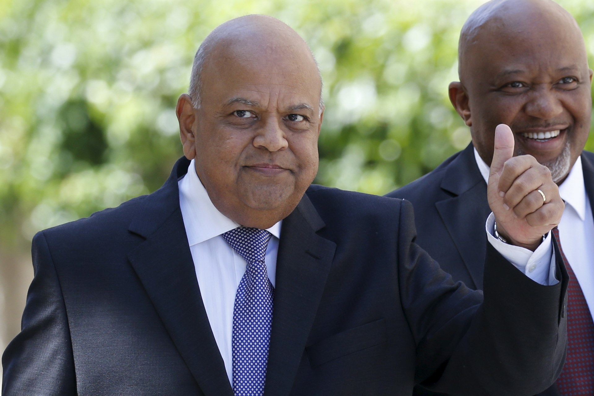 <p>South Africa’s Finance Minister Pravin Gordhan gestures as he arrives to deliver his 2016 budget address to the parliament in Cape Town, February 24, 2016. </p>
