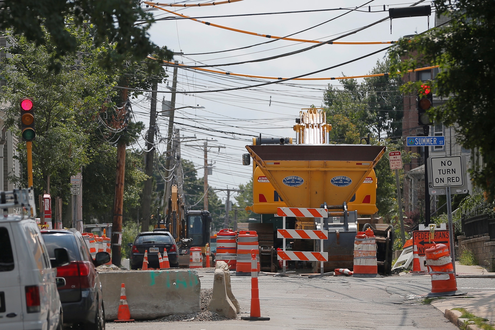 <p>Construction equipment fills a portion of Cedar Street during a years-long water main and sewer renovation project under the street in Somerville, Massachusetts, U.S.</p>
