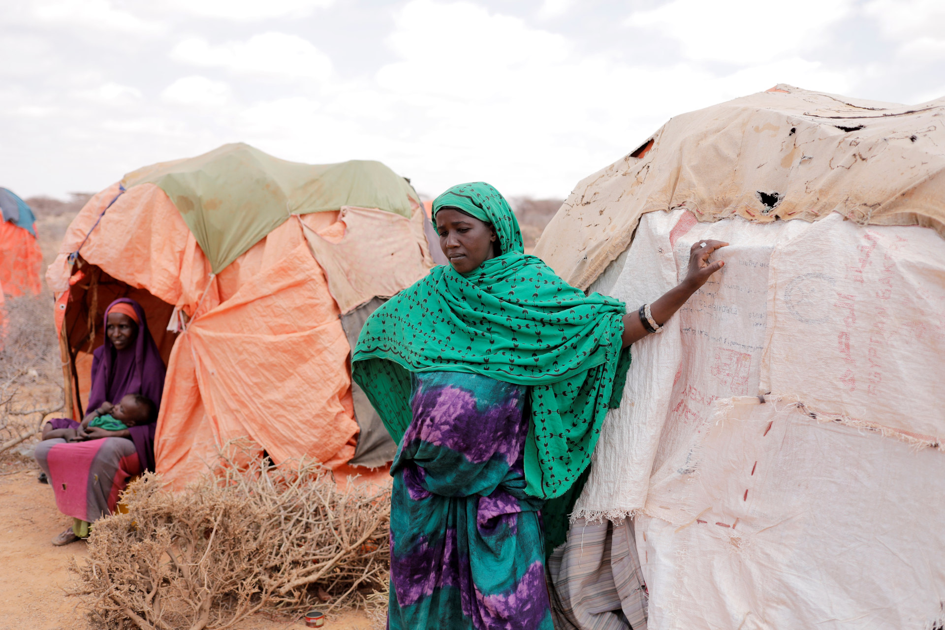 <p>A pregnant young woman stands beside her shelter at a makeshift settlement in Bardihahle near Burao, northwestern Togdheer region of Somaliland March 26, 2017</p>
