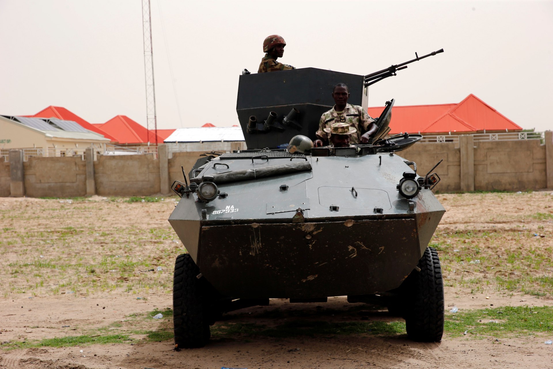 <p>Soldiers stand guard on a armoured tank outside an internal displaced persons (IDP) camp during the official flag-off of food and relief materials distribution for the internal displaced persons in Nigerian city of Maiduguri, June 8, 2017.</p>