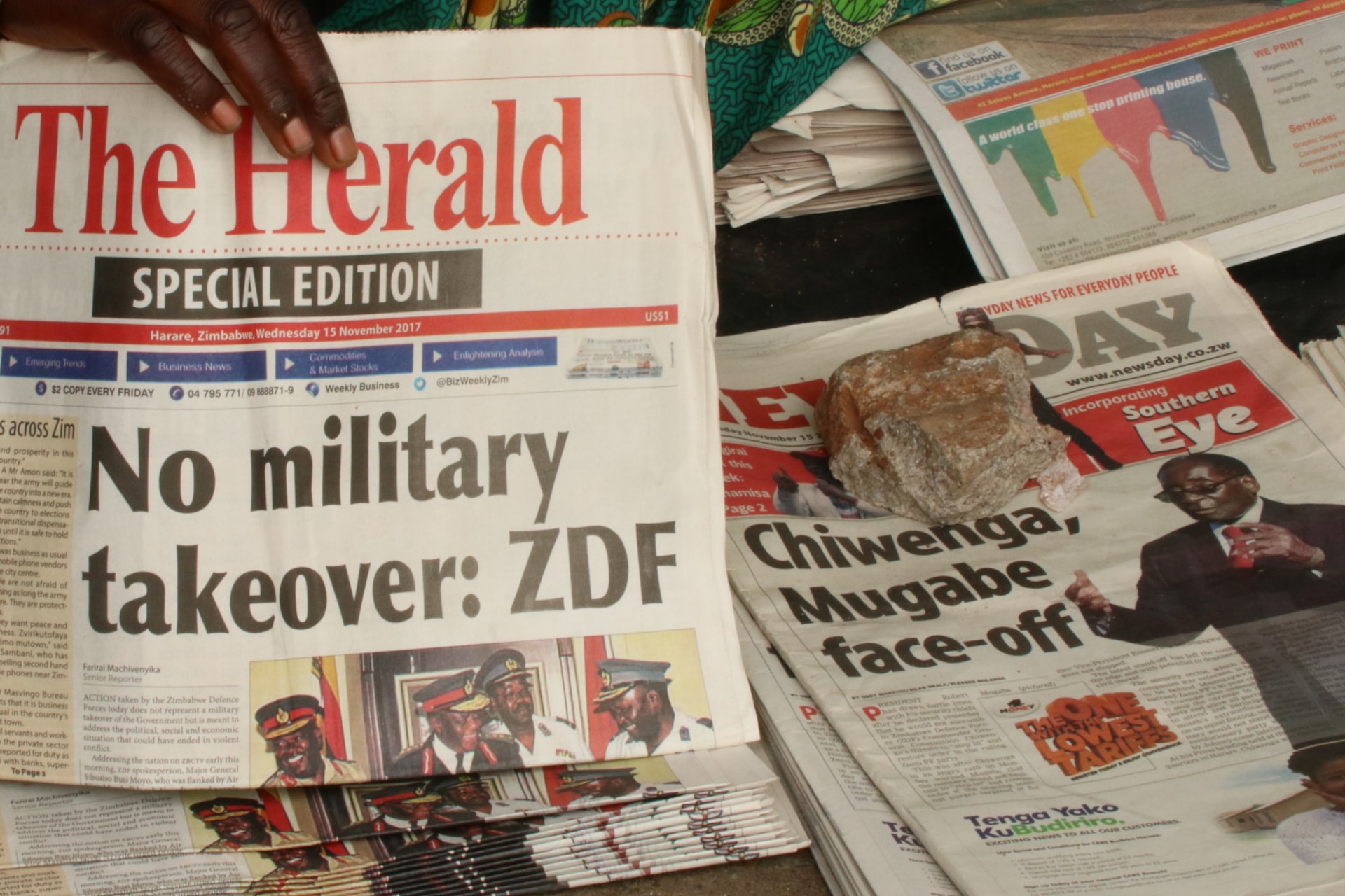 <p>A vendor picks up a copy of a special edition of the state-owned daily newspaper The Herald in Harare, Zimbabwe November 15, 2017. The military has repeatedly stressed that no coup has taken place.</p>