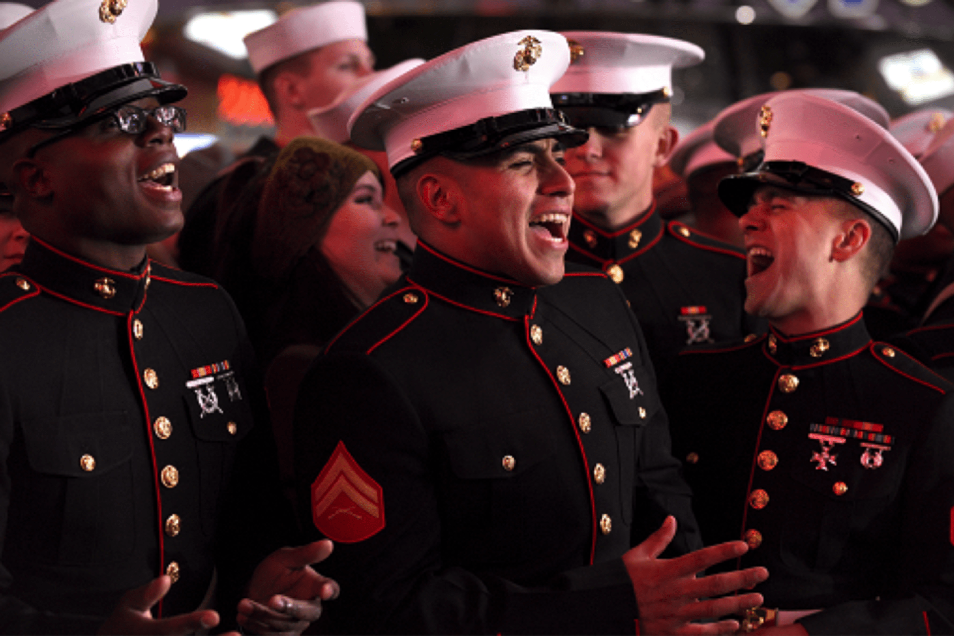 <p>Members of the U.S. Marine Corps celebrating</p>
