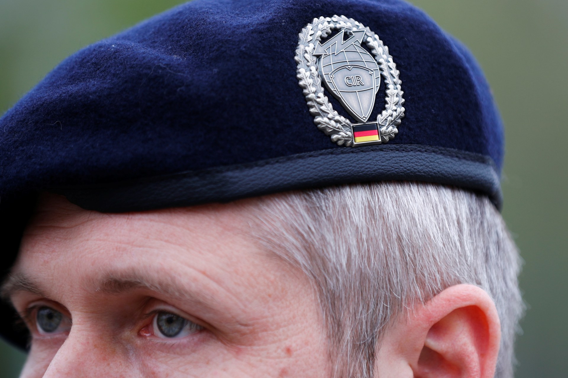 <p>The badge of Germany’s cyber and information space command on the cap of a soldier.</p>