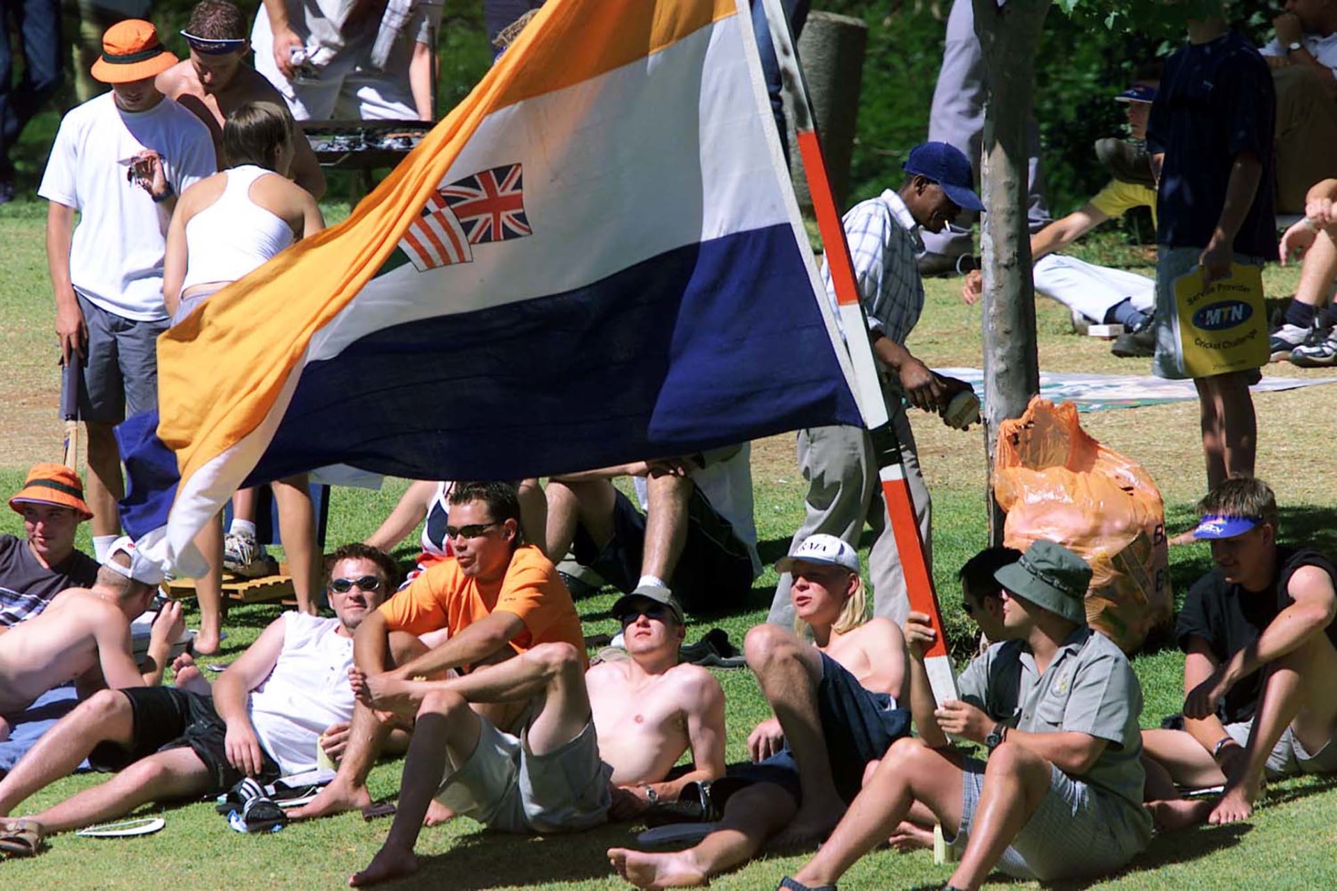 <p>South African cricket fans with an apartheid era flag watch the last day of the first test match against New Zealand in South Africa, November 21, 2000. This flag was reportedly flown at recent Black Monday protests in South Africa.</p>
