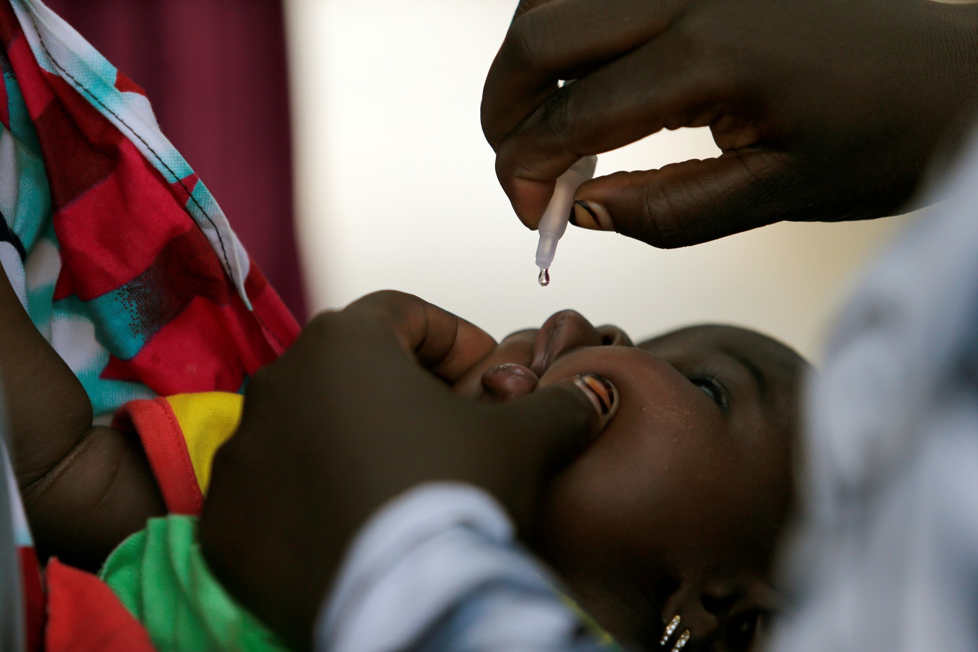 <p>A child is given a dose of polio vaccine at an immunization health center, in Maiduguri, Borno State, Nigeria, August 29, 2016. Boko Haram has wrought immense destruction to Borno state and the greater Lake Chad basin.</p>
