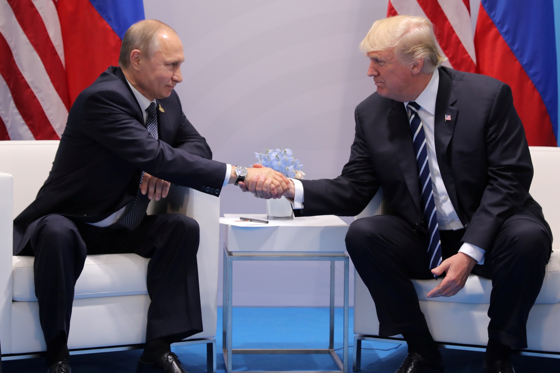 <p>President Donald Trump shakes hands with Russia’s President Vladimir Putin.</p>
