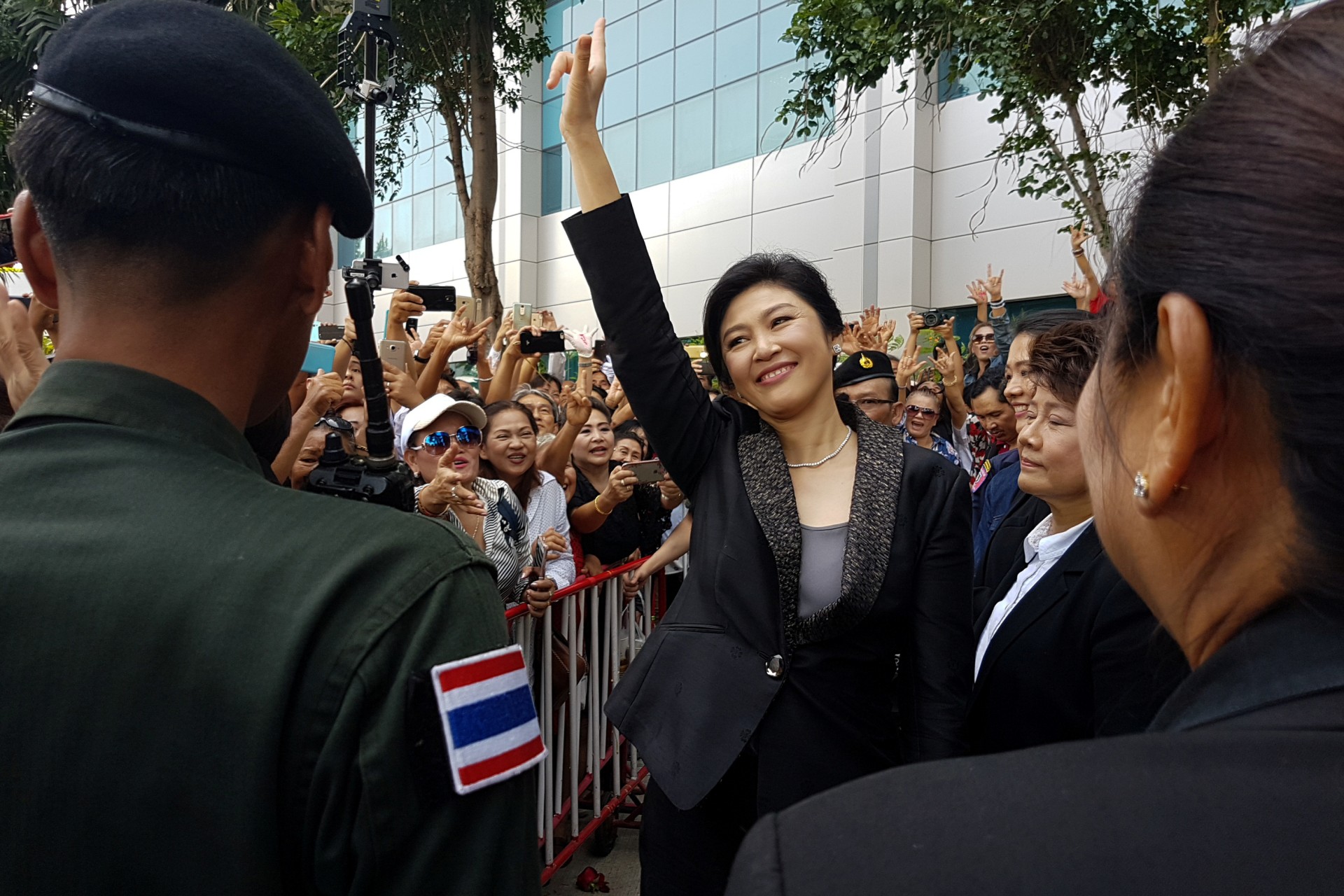 <p>Ousted former Thai Prime Minister Yingluck Shinawatra greets supporters as she leaves the Supreme Court in Bangkok, Thailand, on August 1, 2017.</p>
