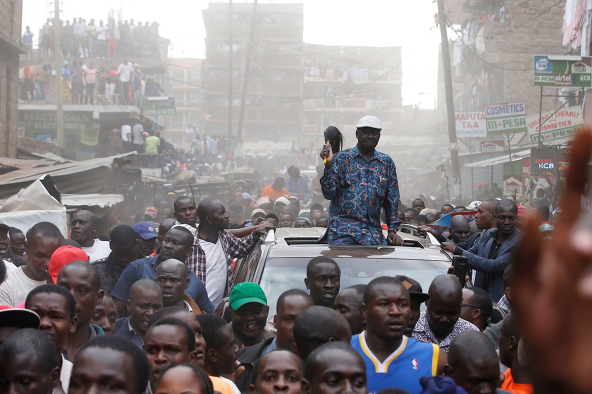 <p>Opposition leader Raila Odinga greets supporters after a rally in Nairobi, Kenya.</p>
