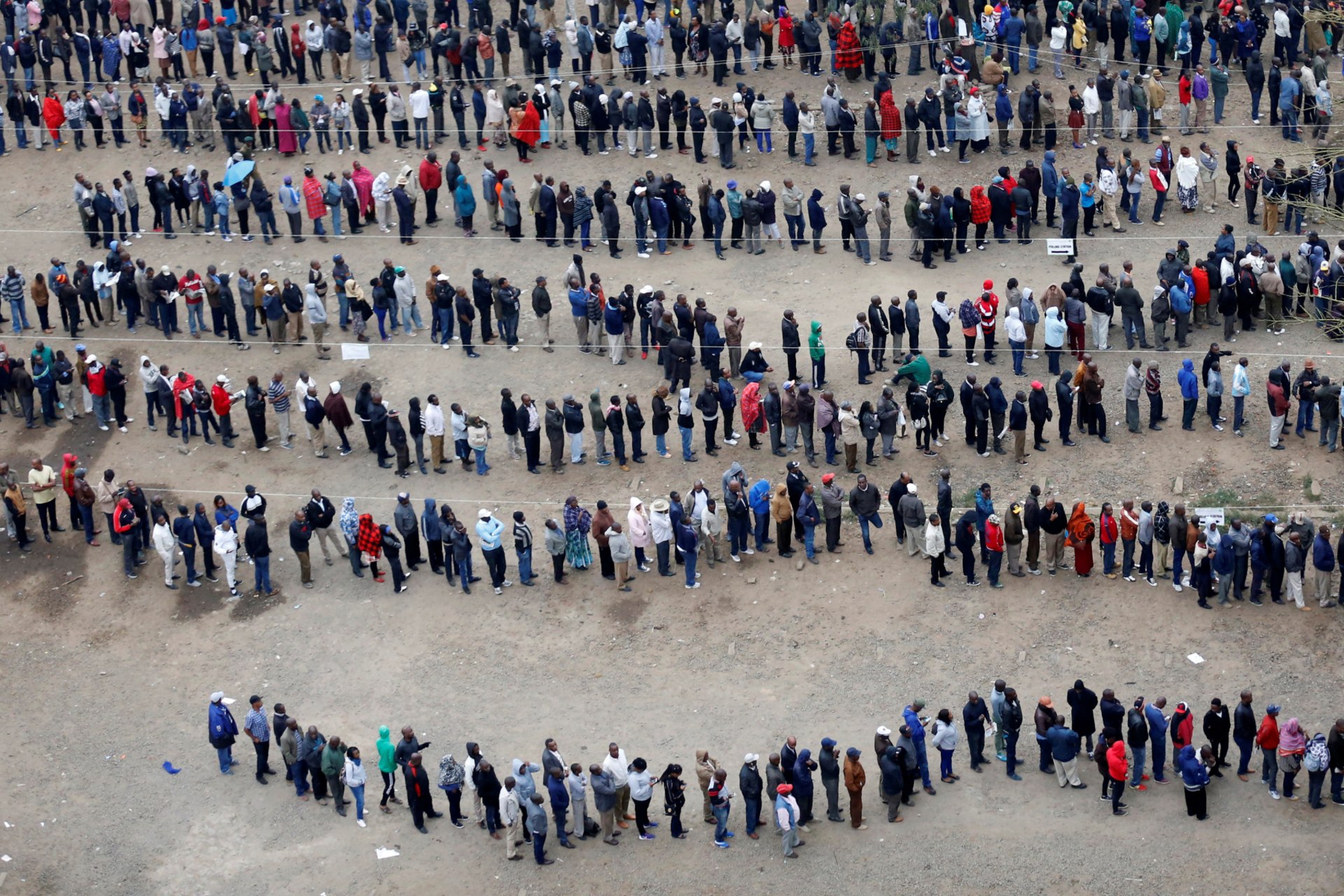 <p>People outside a polling station during the presidential election in the city centre in Nairobi, Kenya, August 8, 2017. Voting itself tends to be peaceful; the potential for violence once results are announced is what has people worried.</p>
