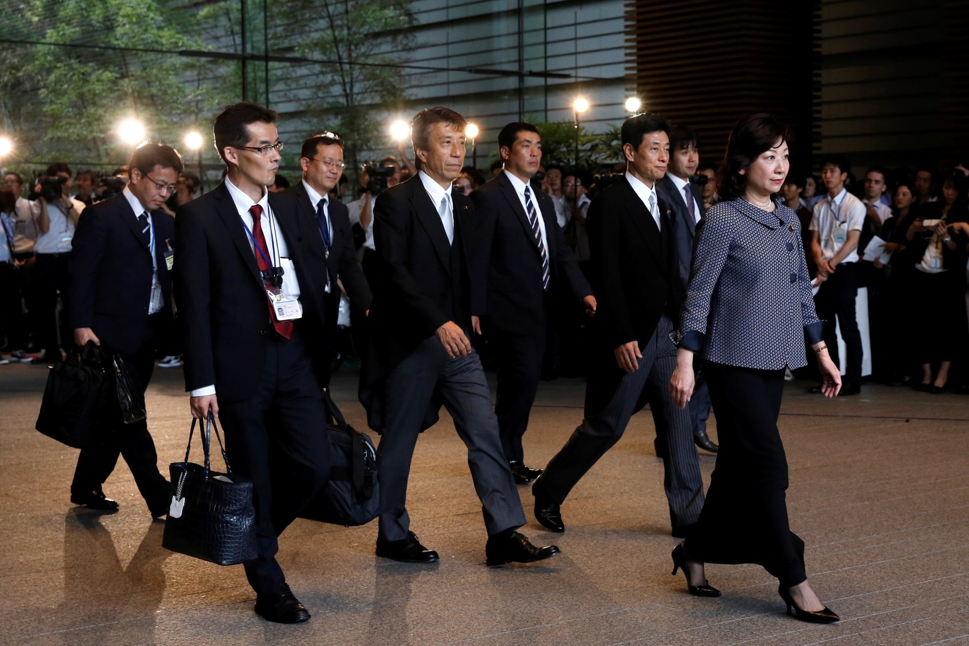 <p>Japan’s new Internal Affairs Minister Seiko Noda and new Agriculture, Forestry, and Fisheries Minister Ken Saito leave Prime Minister Shinzo Abe’s official residence on August 3, 2017.</p>

