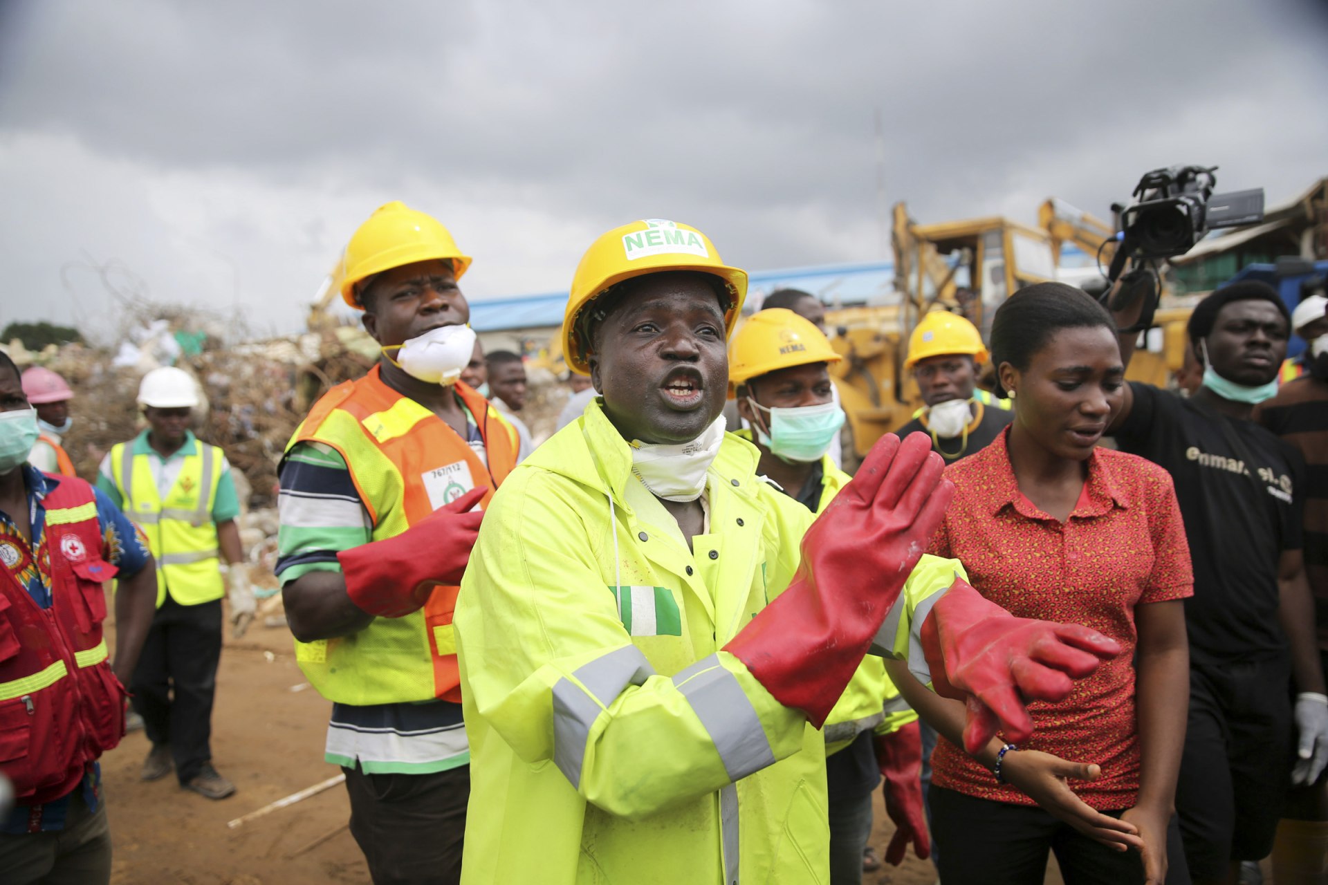 <p>National Emergency Management Agency (NEMA) spokesman Ibrahim Farinloye reacts at the site of a collapsed building in Nigeria in 2014. NEMA functions as Nigeria’s disaster management agency, and comes to the aid of local communities in distress. </p>
