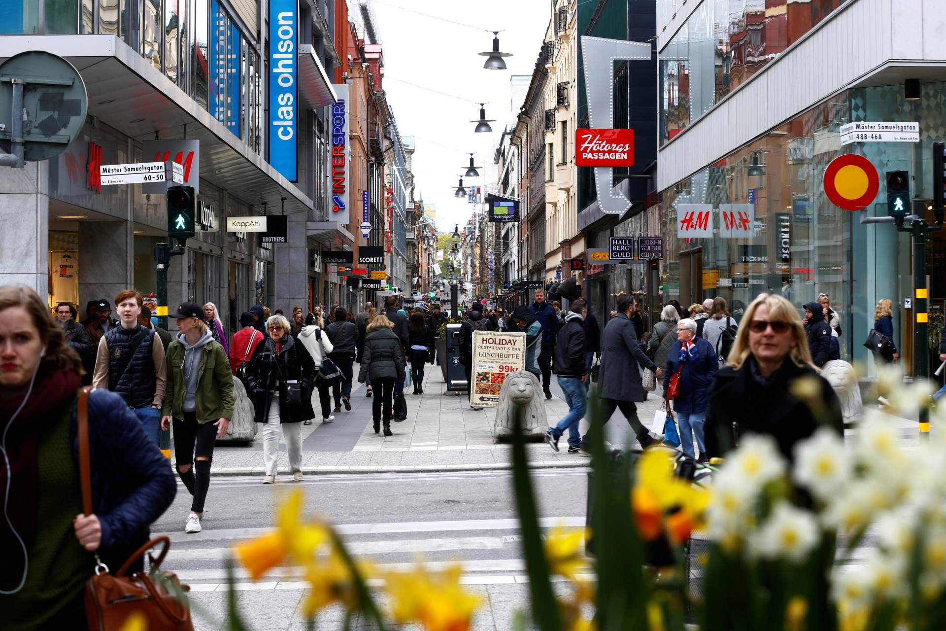 <p>People walk through the shopping area on the pedestrian street Drottninggatan in Stockholm, Sweden.</p>