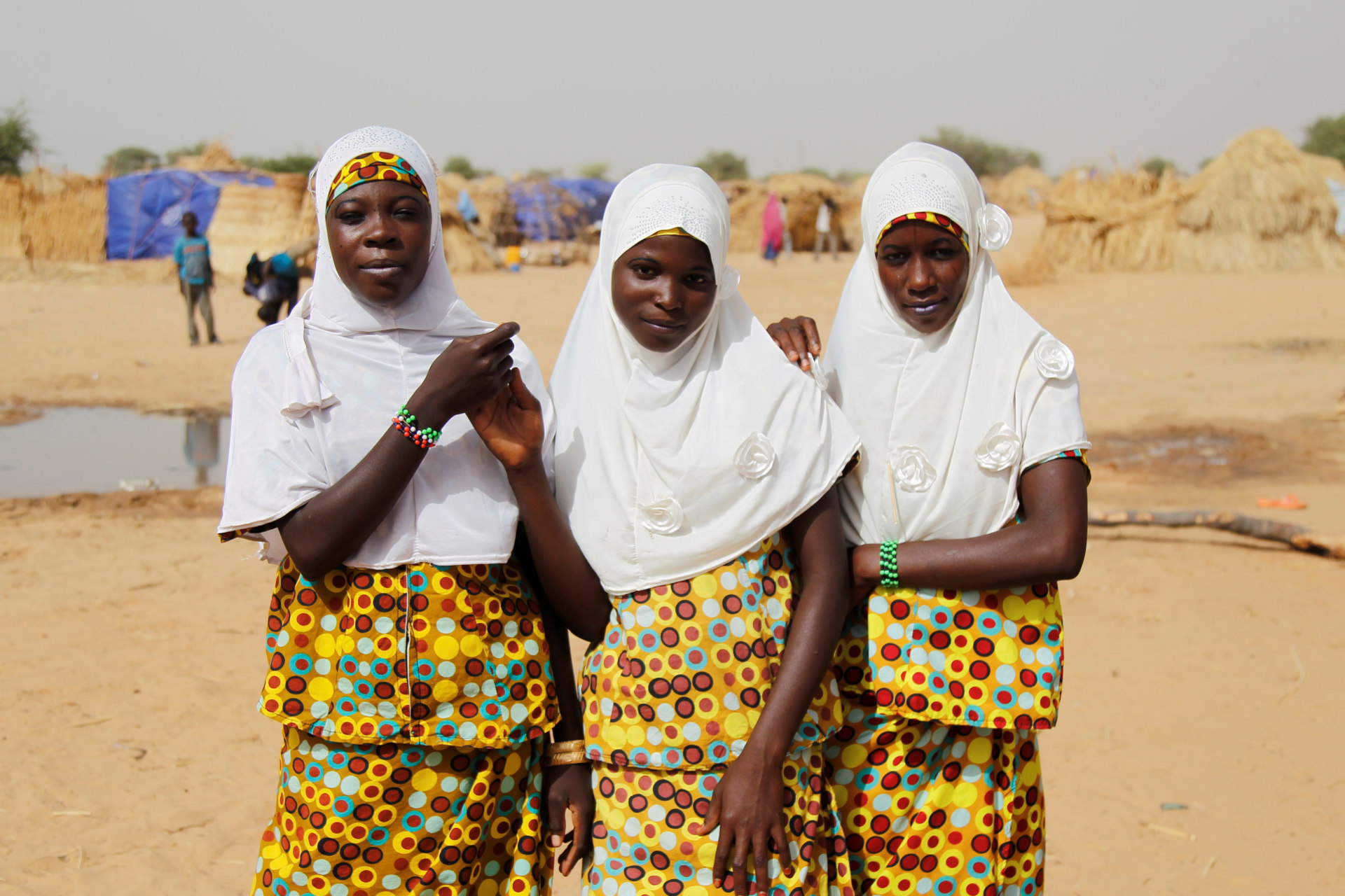 <p>Adolescent girls pose for pictures at the Boudouri site for displaced persons outside the town of Diffa in southeastern Niger June 18, 2016. </p>
