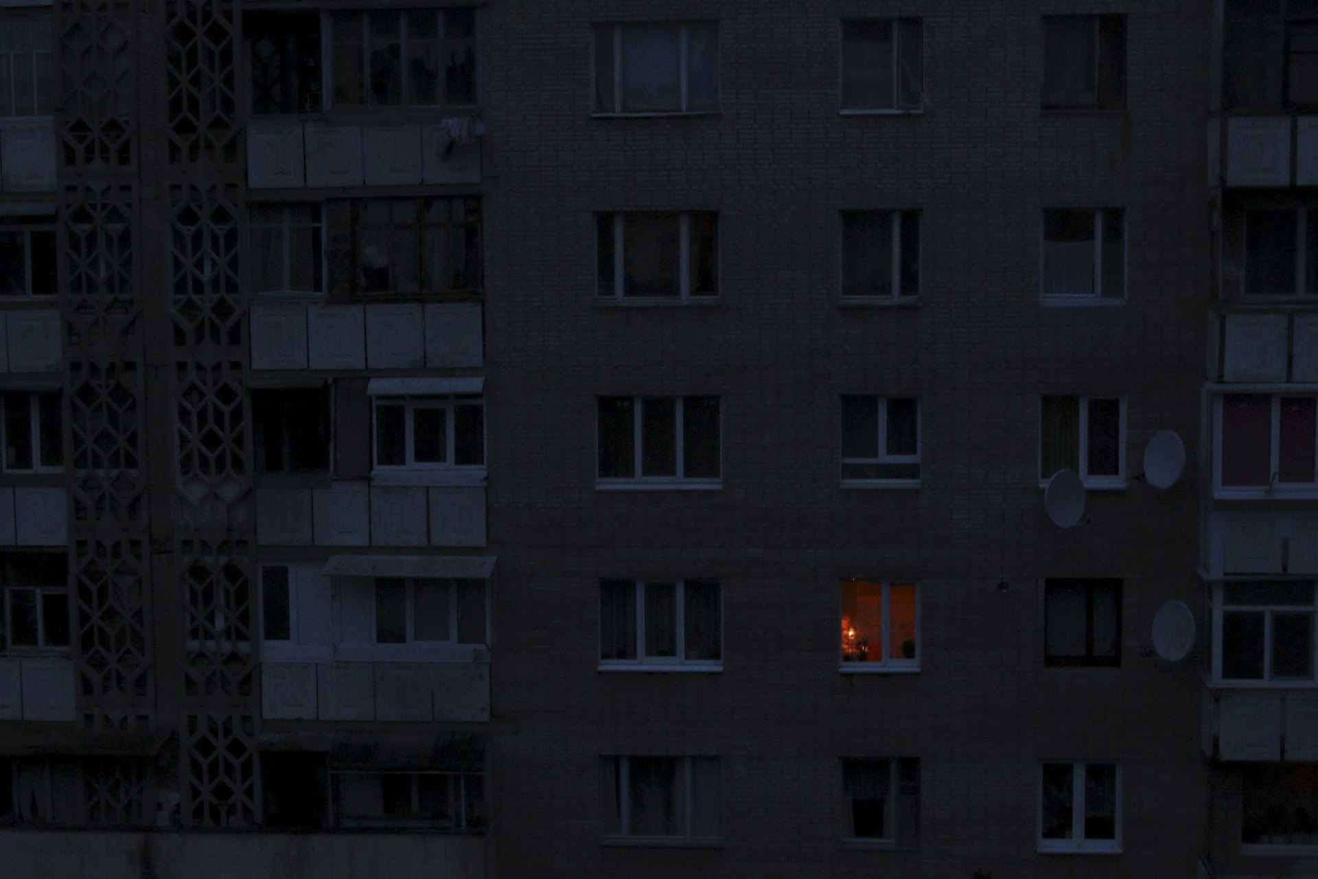 <p>A single light illuminates a room during a blackout at a residential building in Simferopol, Crimea November 24, 2015.</p>

