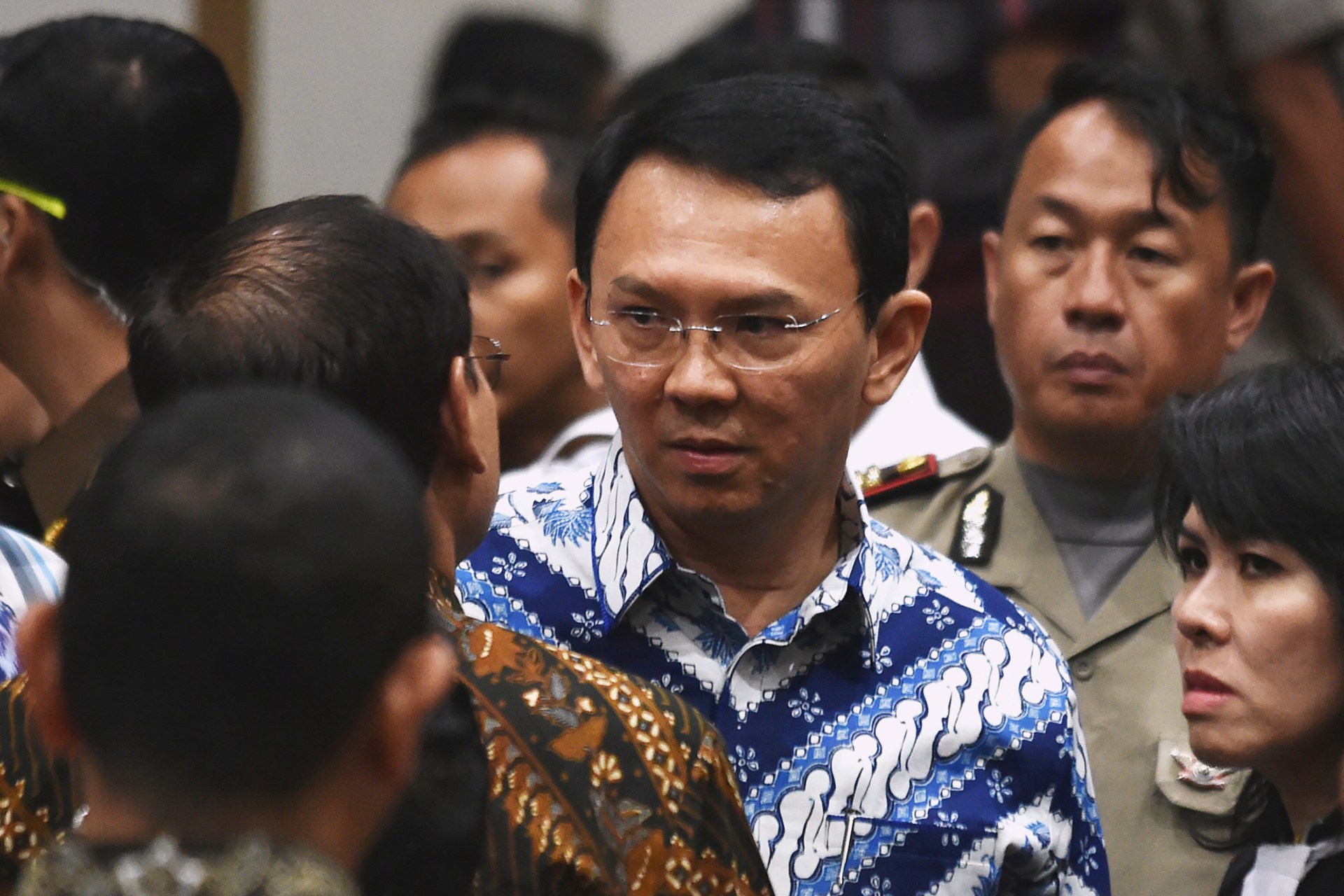 <p>Jakarta’s Christian governor Basuki Tjahaja Purnama, popularly known as Ahok, speaks to his lawyers after the guilty verdict in his blasphemy trial in Jakarta on May 9, 2017. </p>
