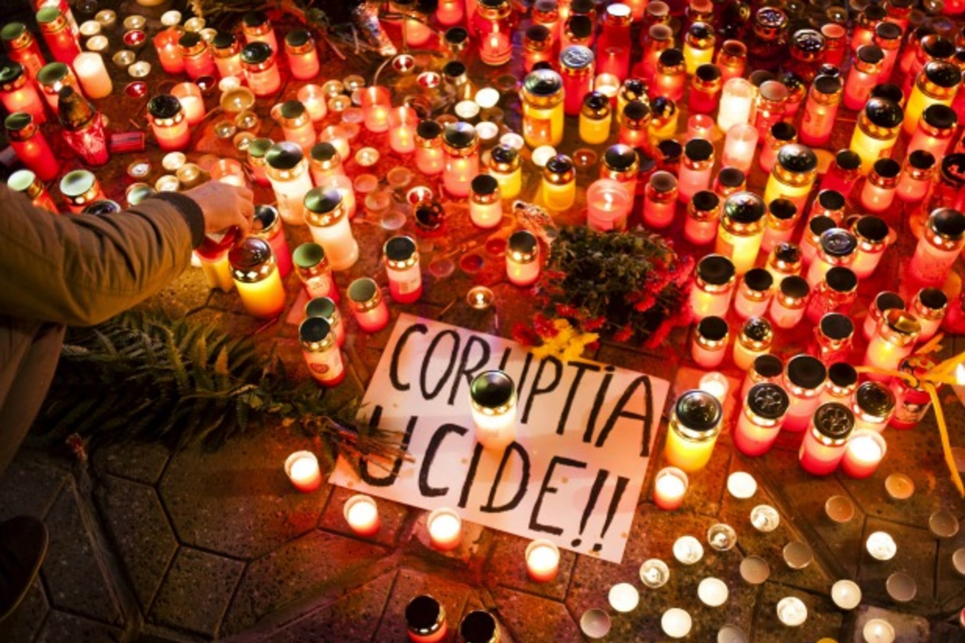 <p>A banner reading “Corruption kills” is placed among candles, lit in memoriam of more than 50 people killed when a fire erupted…e died reflect growing anger at a culture of official graft in one of Europe’s most corrupt countries (Reuters/Inquam Photos).</p>