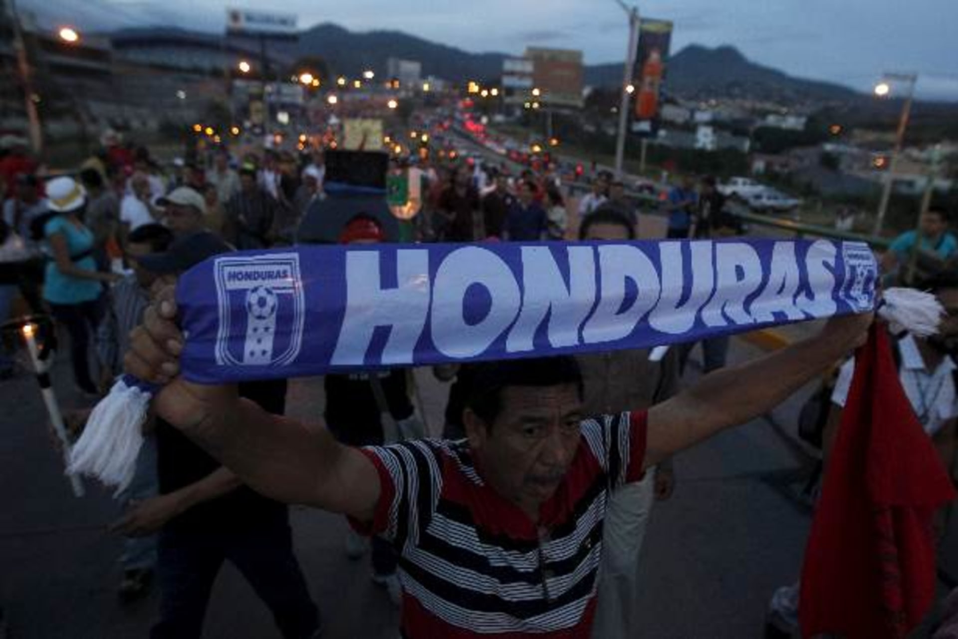 <p>A demonstrator holds a scarf during a march to demand for the resignation of Honduran President Juan Orlando Hernandez in Tegu…tion of Hernandez over a $200 million corruption scandal at the Honduran Institute of Social Security (Jorge Cabrera/Reuters).</p>