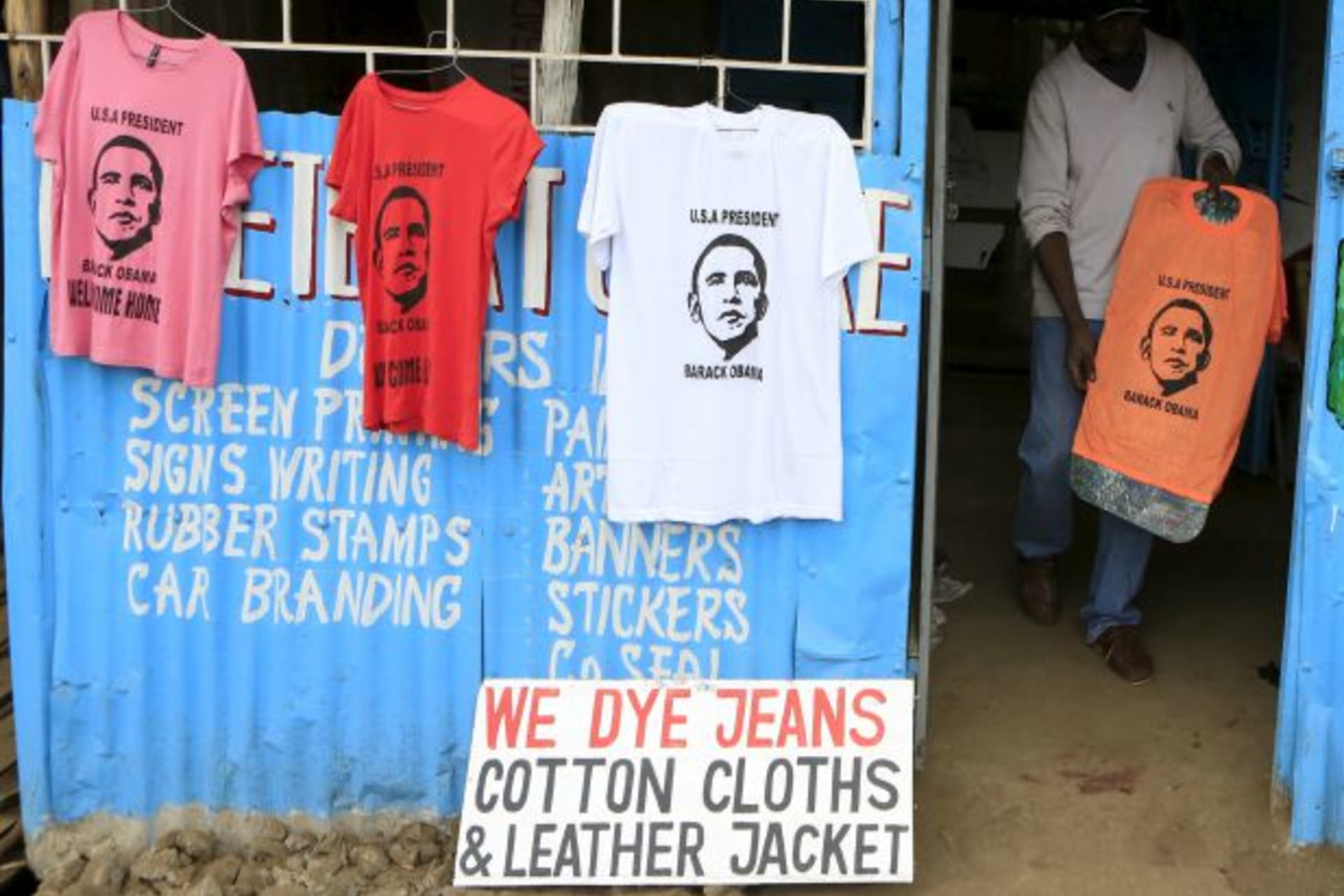 <p>Wycliff Madegwa prepares to display a t-shirt newly printed with the image of U.S. President Barack Obama, ahead of his schedu…ection to his father’s birthplace will dominate a trip that Kenyans view as a native son returning home (Noor Khamis/Reuters).</p>
