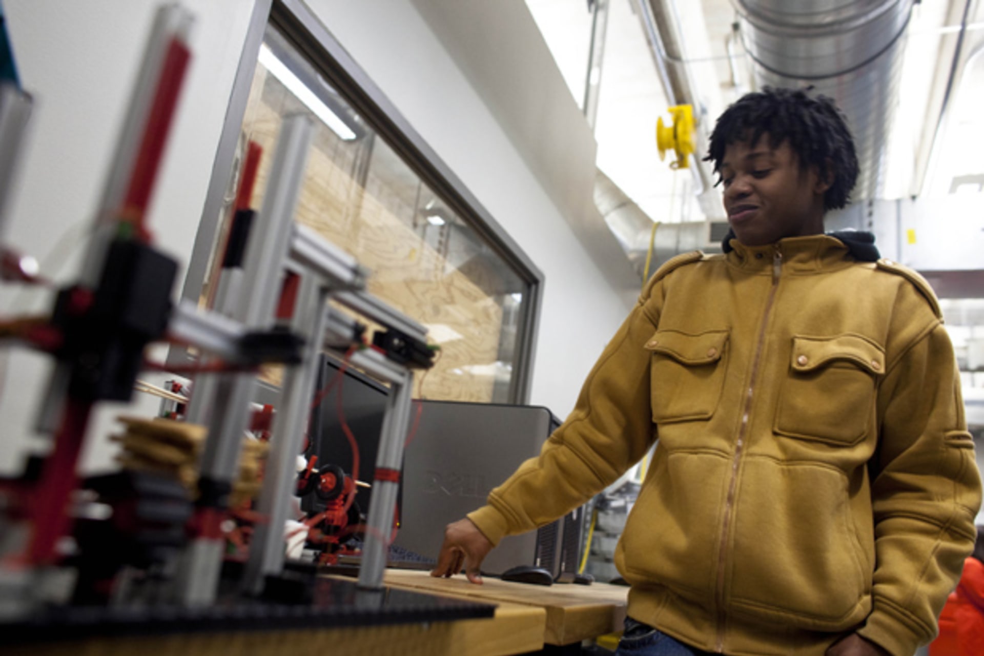 Yaun Smith, a senior, talks about his class's assembly line to make a s’more as a class project as part of the Project Lead the Way class at Bradley Tech High School in Milwaukee, Wisconsin (Darren Hauck/Courtesy Reuters).