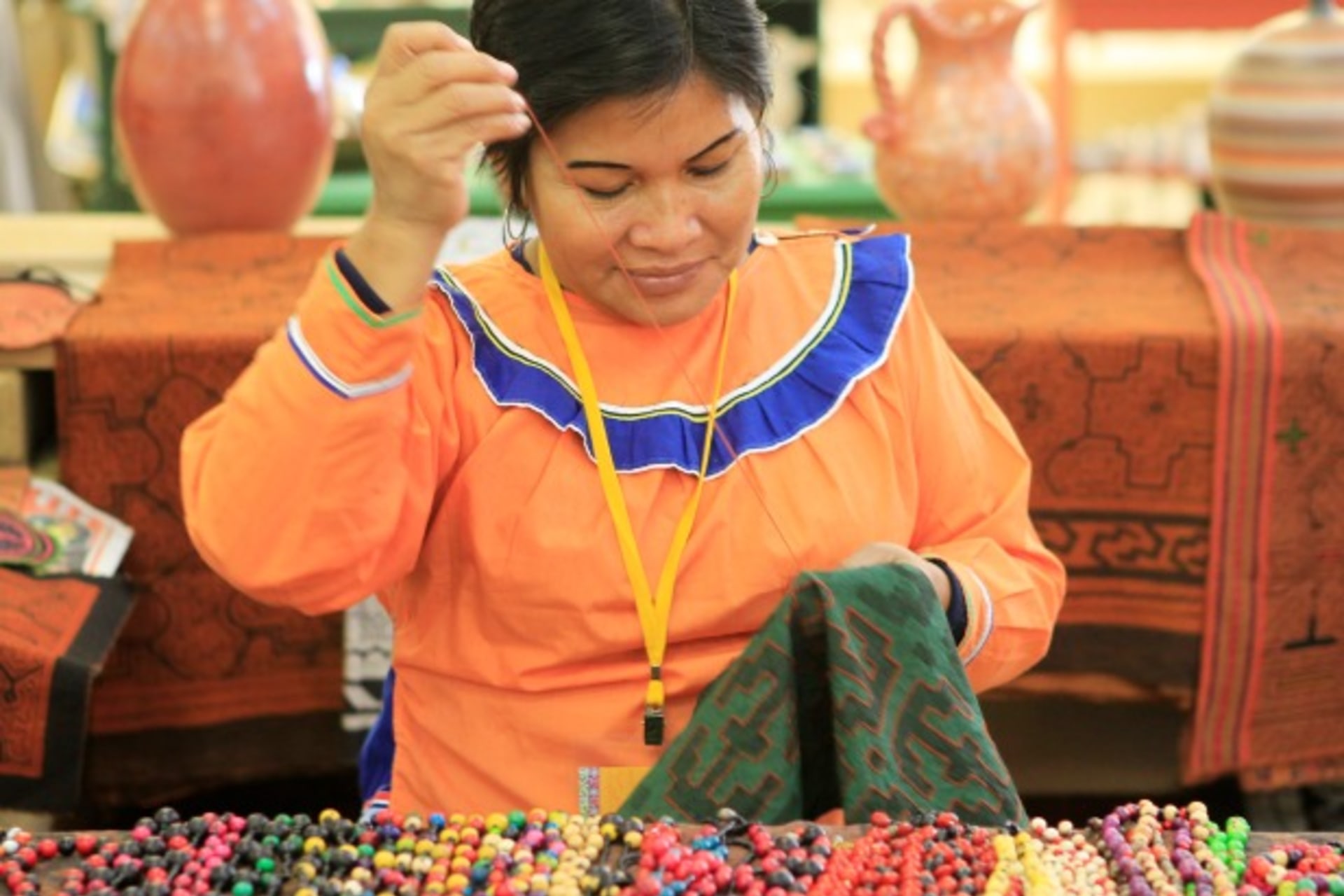 <p>A woman from the Amazon region weaves a textile in Lima, Peru, July 2012 (Courtesy Reuters/Enrique Castro-Mendivil).</p>
