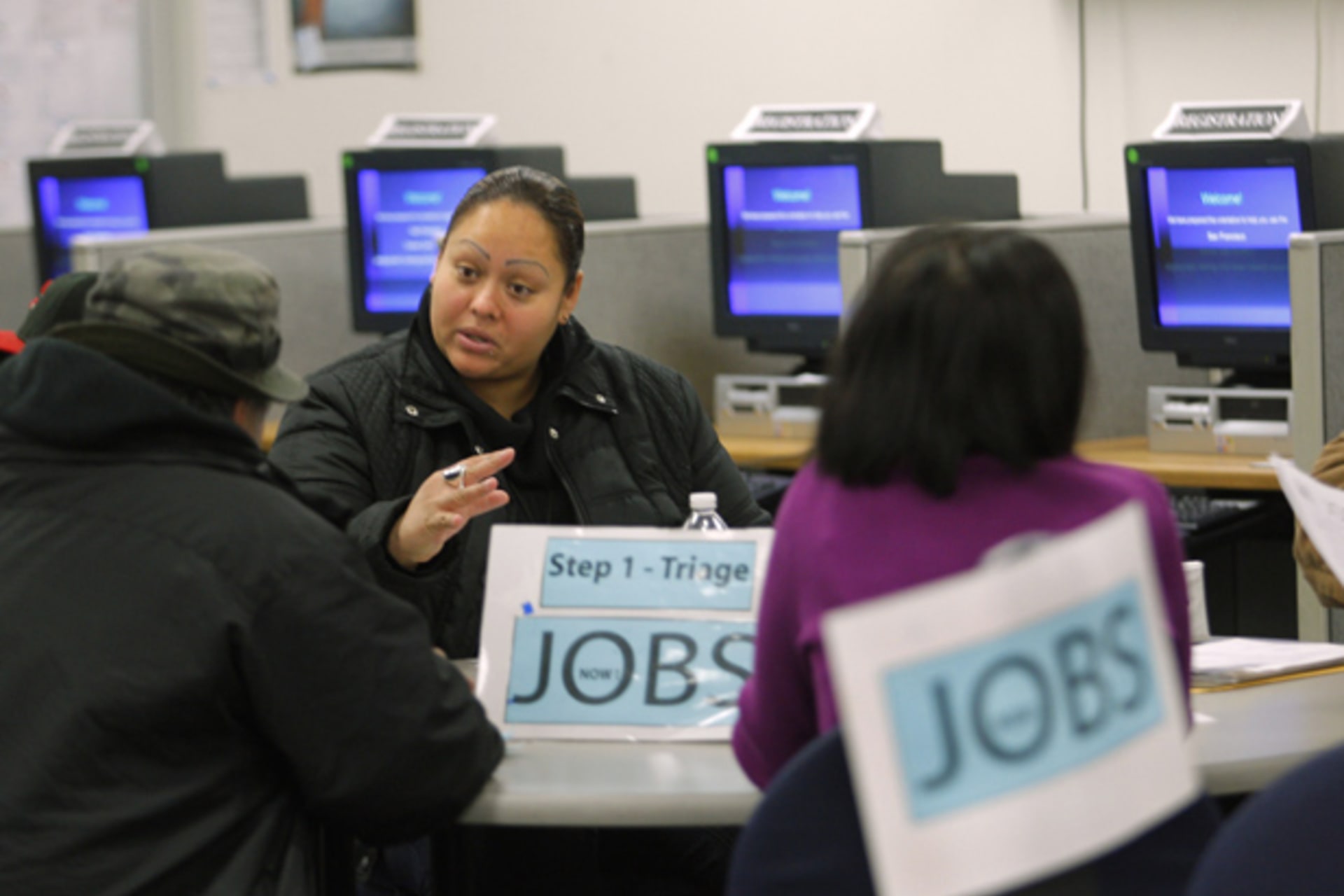 <p>Case worker Jessica Yon discusses job eligibility for unemployed people at a jobs center in San Francisco, California (Robert Galbraith/Courtesy Reuters).</p>
