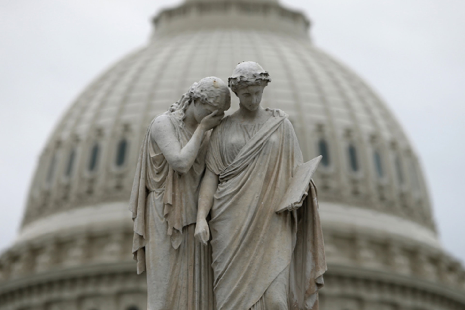 The statue of Grief and History stands in front of the U.S. Capitol dome in Washington (Kevin Lamarque/Courtesy Reuters).