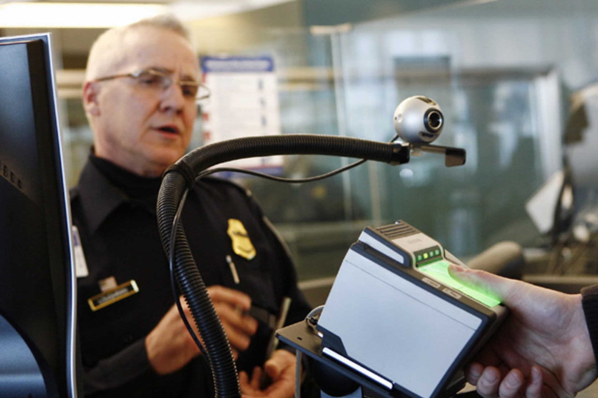 A traveler has his fingerprints scanned at the international travel entry point at JFK International Airport in New York on March 25, 2008 (Shannon Stapleton/Courtesy Reuters).