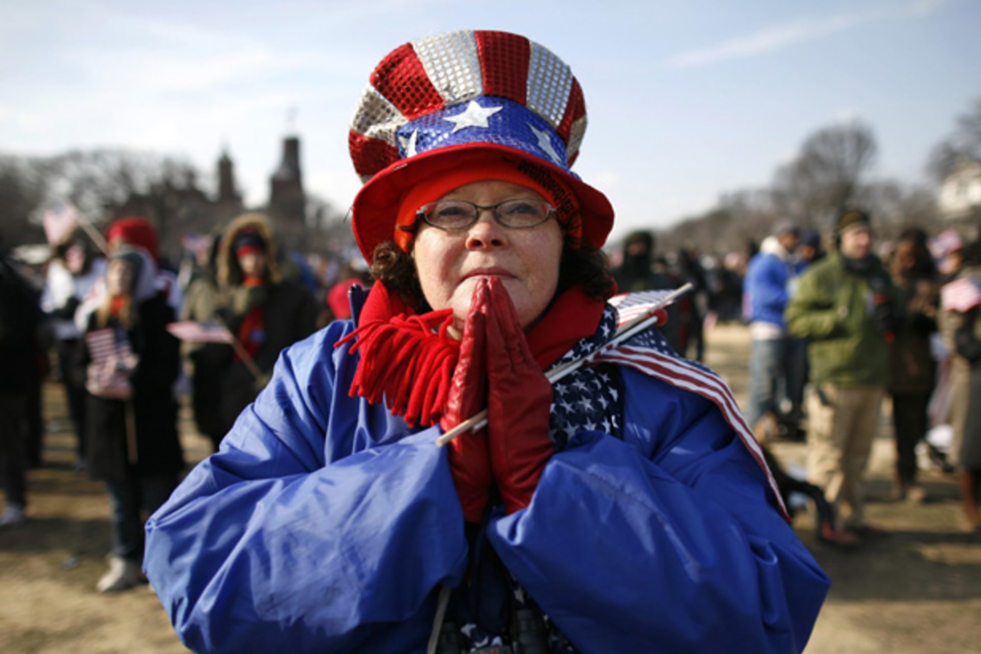 <p>An attendee prays during the inauguration ceremony of Barack Obama as the 44th president of the United States (Shannon Stapleton/Courtesy Reuters).</p>