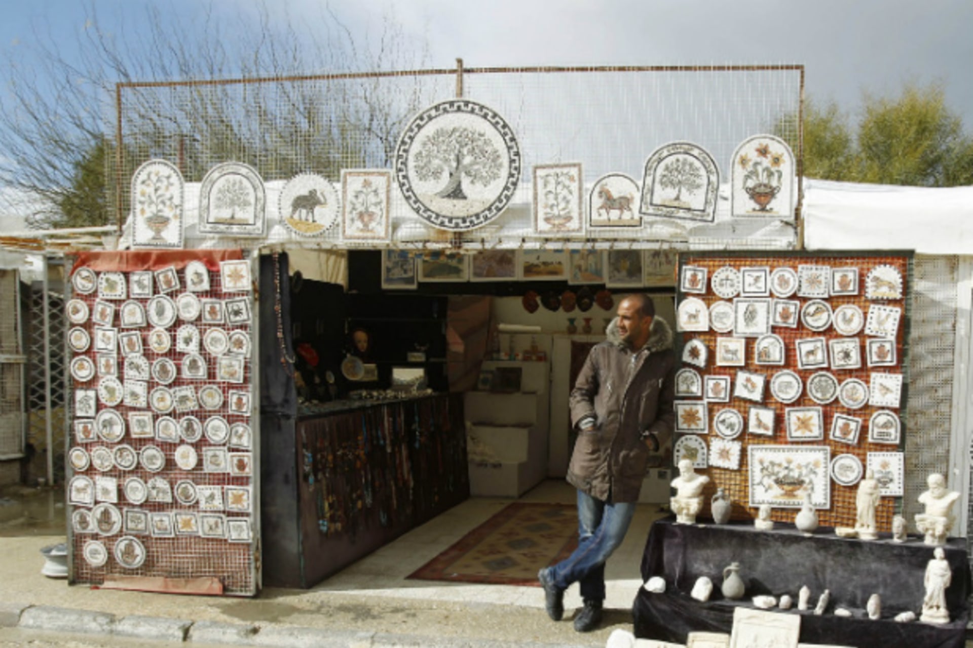 <p>A man waits for tourists to visit his souvenir shop in Carthage, near Tunis, Tunisia February 10, 2013 (Zoubeir Souissi/Courtesy Reuters).</p>
