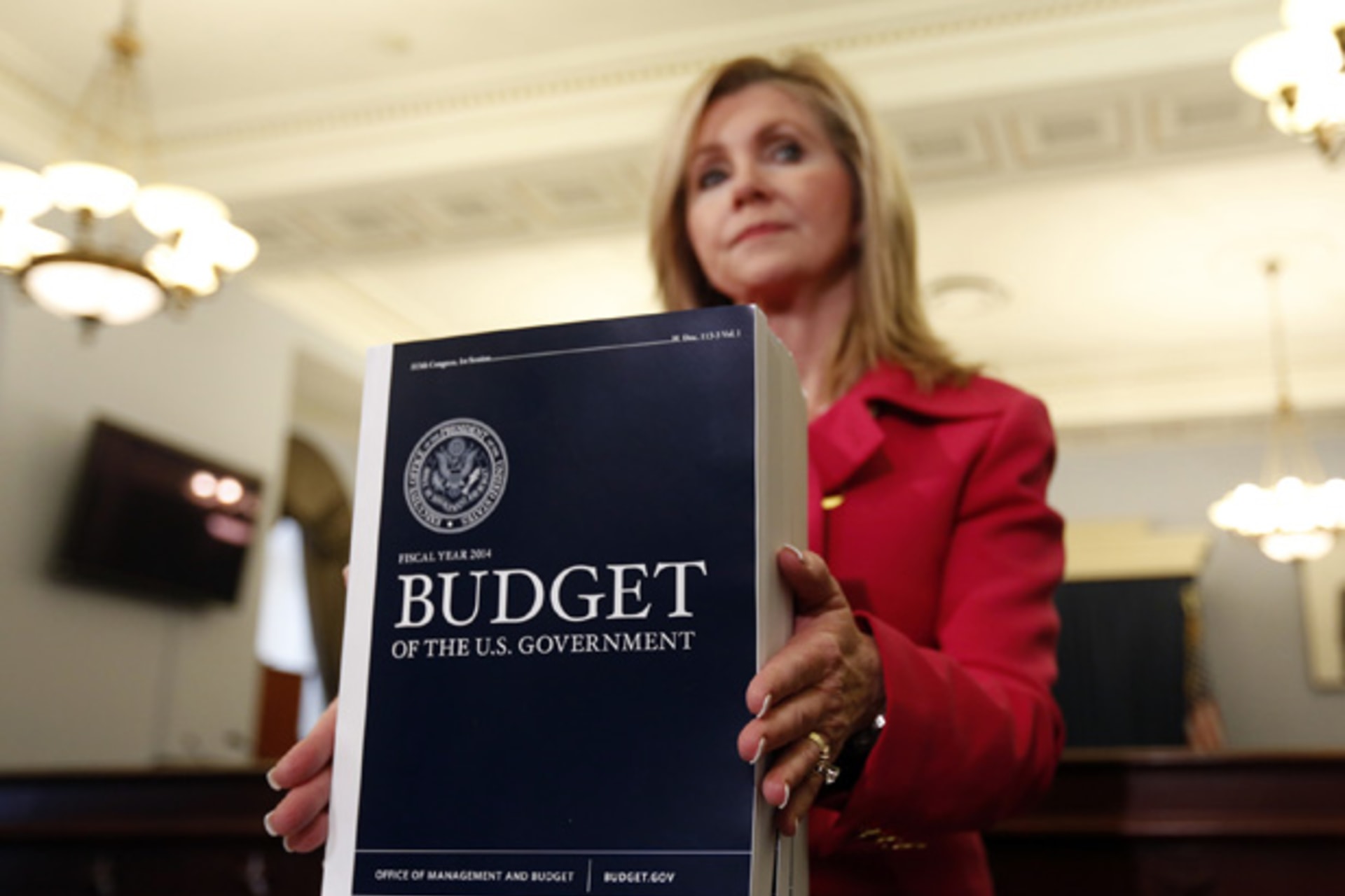 <p>House Budget Committee member Marsha Blackburn (R-TN) displays a copy of U.S. President Barack Obama’s FY2014 budget proposal on April 10, 2013 (Kevin Lamarque/Courtesy Reuters).</p>