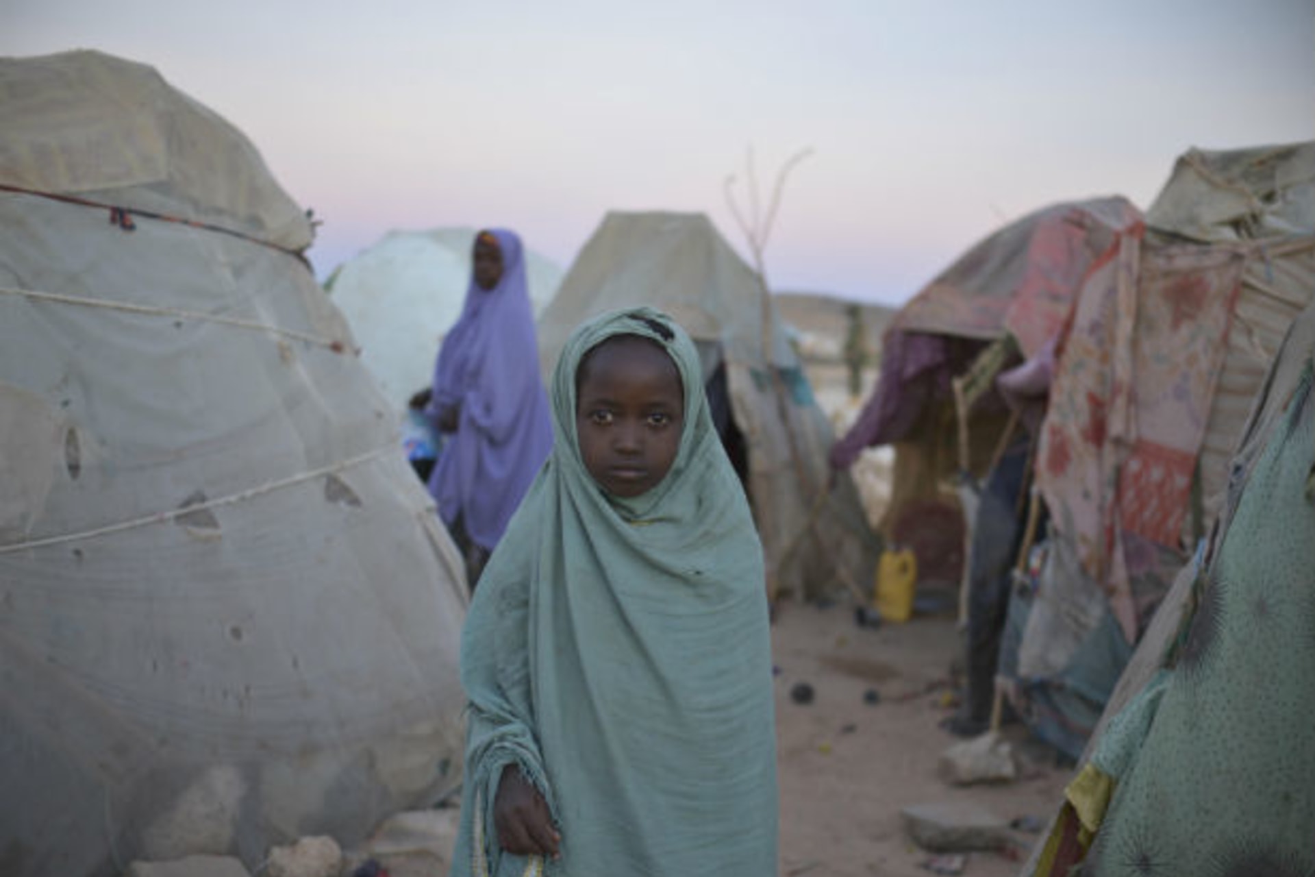 <p>A girl stands in a camp for internally displaced persons (IDP) on the outskirts of Belet Weyne, about 315 km (196 miles) from …this picture provided by the African Union-United Nations Information Support (AU-UN IST) team (Tobin Jones/Courtesy Reuters).</p>
