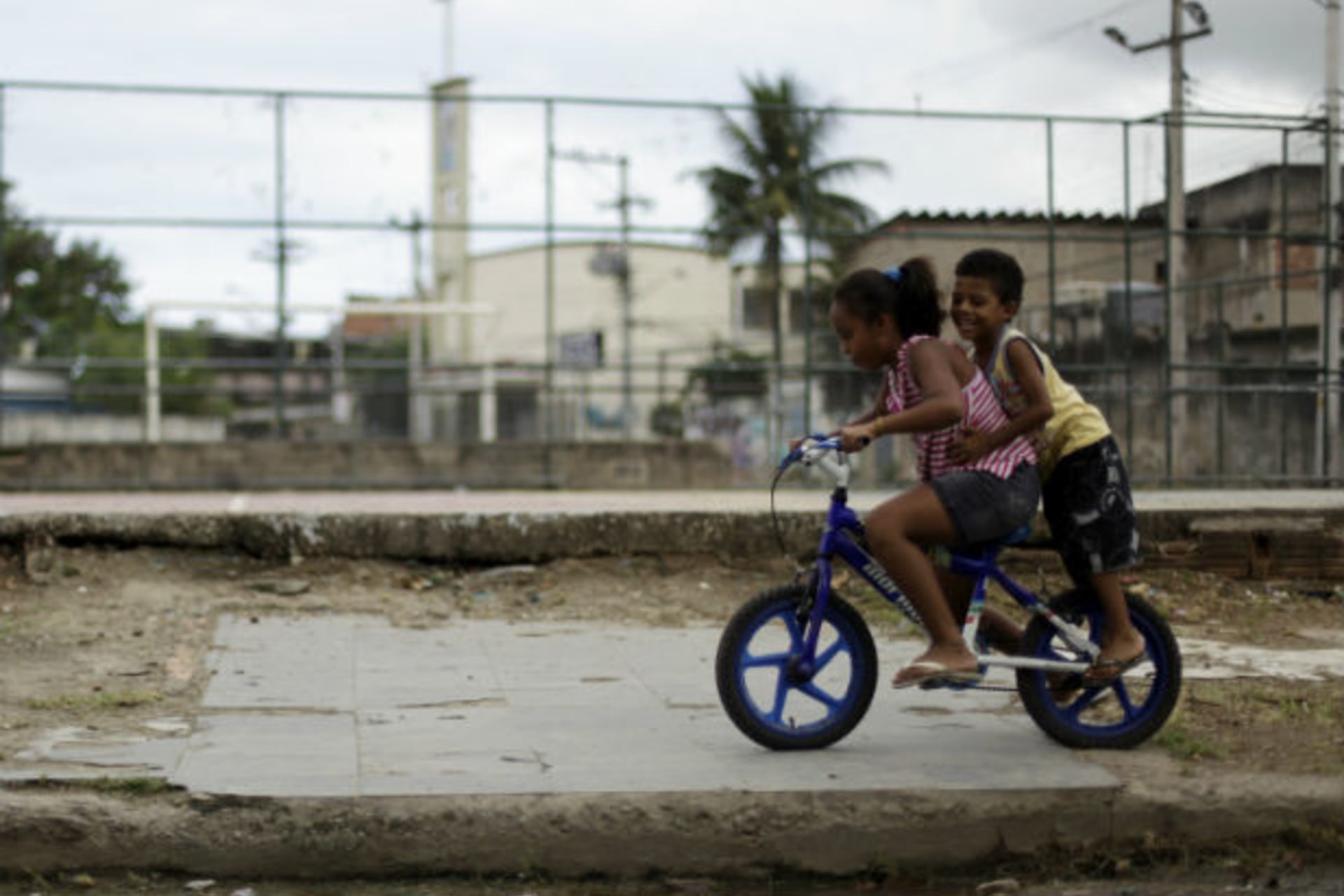 <p>Children play in front of the field at Cidade de Deus (City of God) slum in Rio de Janeiro March 15, 2011, where U.S. President Barrack Obama will visit on Sunday, according to the local press (Ricardo Moraes/Courtesy Reuters).</p>
