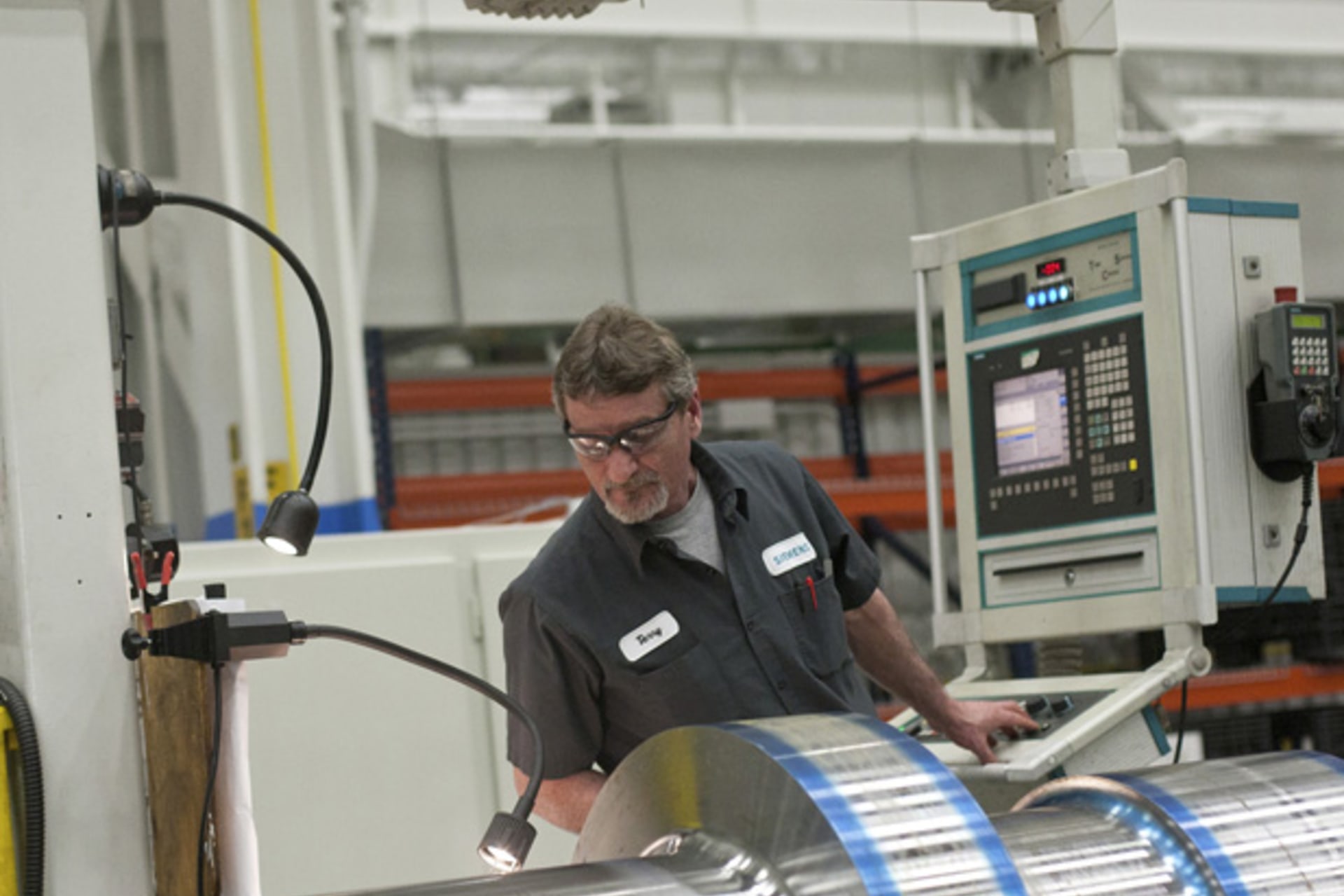 <p>An employee works on a component for a turbine at the Siemens Energy plant in Charlotte, North Carolina (Chris Keane/Courtesy Reuters).</p>
