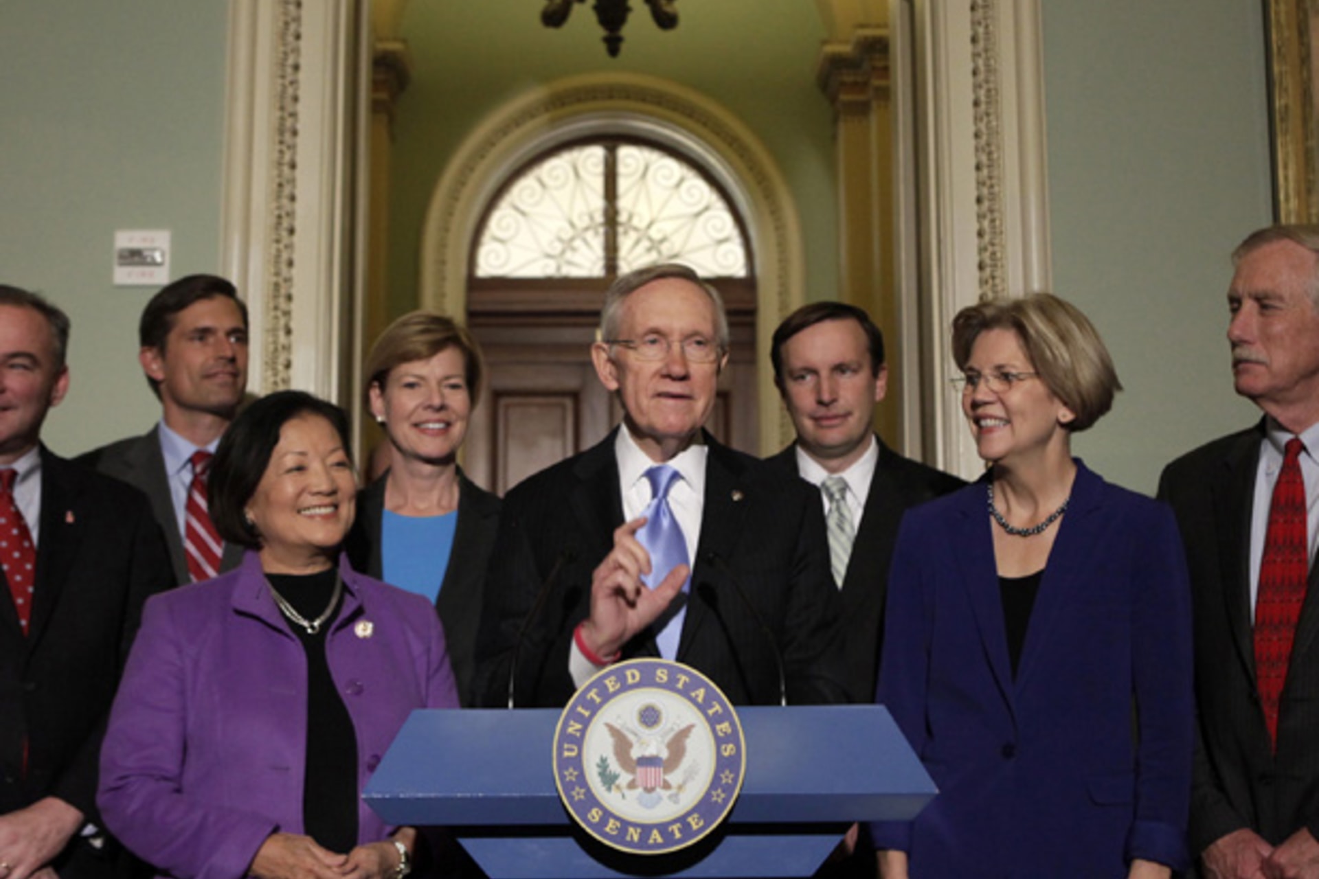 <p>Senate Majority Leader Harry Reid (D-NV) with members of the freshmen class of the 113th Congress on Capitol Hill (Yuri Gripas/Courtesy Reuters).</p>