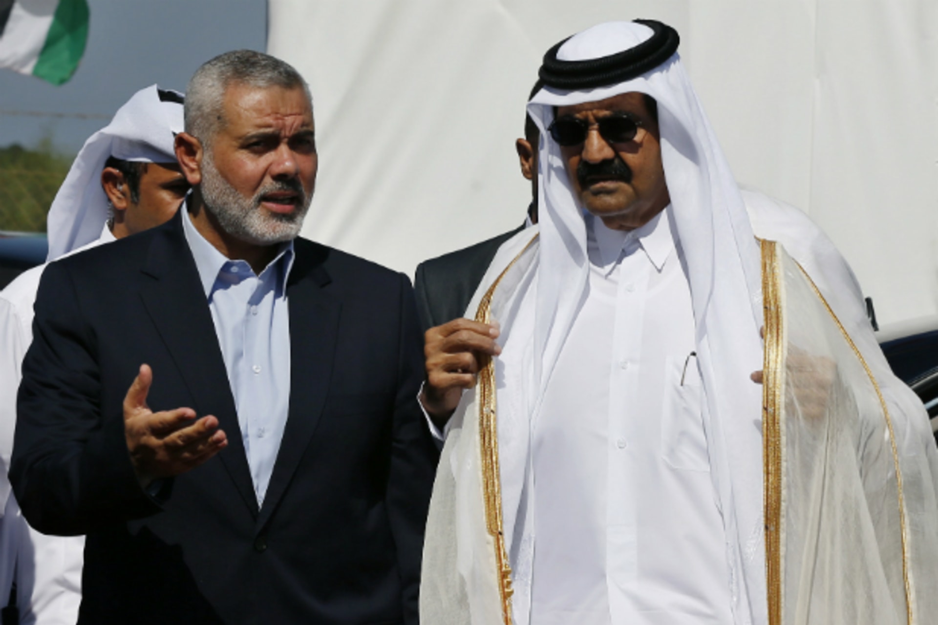 <p>Hamas Prime Minister Ismail Haniyeh (L) and the Emir of Qatar Sheikh Hamad bin Khalifa al-Thani arrive at a cornerstone laying… a new residential neighborhood in Khan Younis in the southern Gaza Strip October 23, 2012. (Courtesy REUTERS/Mohammed Salem).</p>
