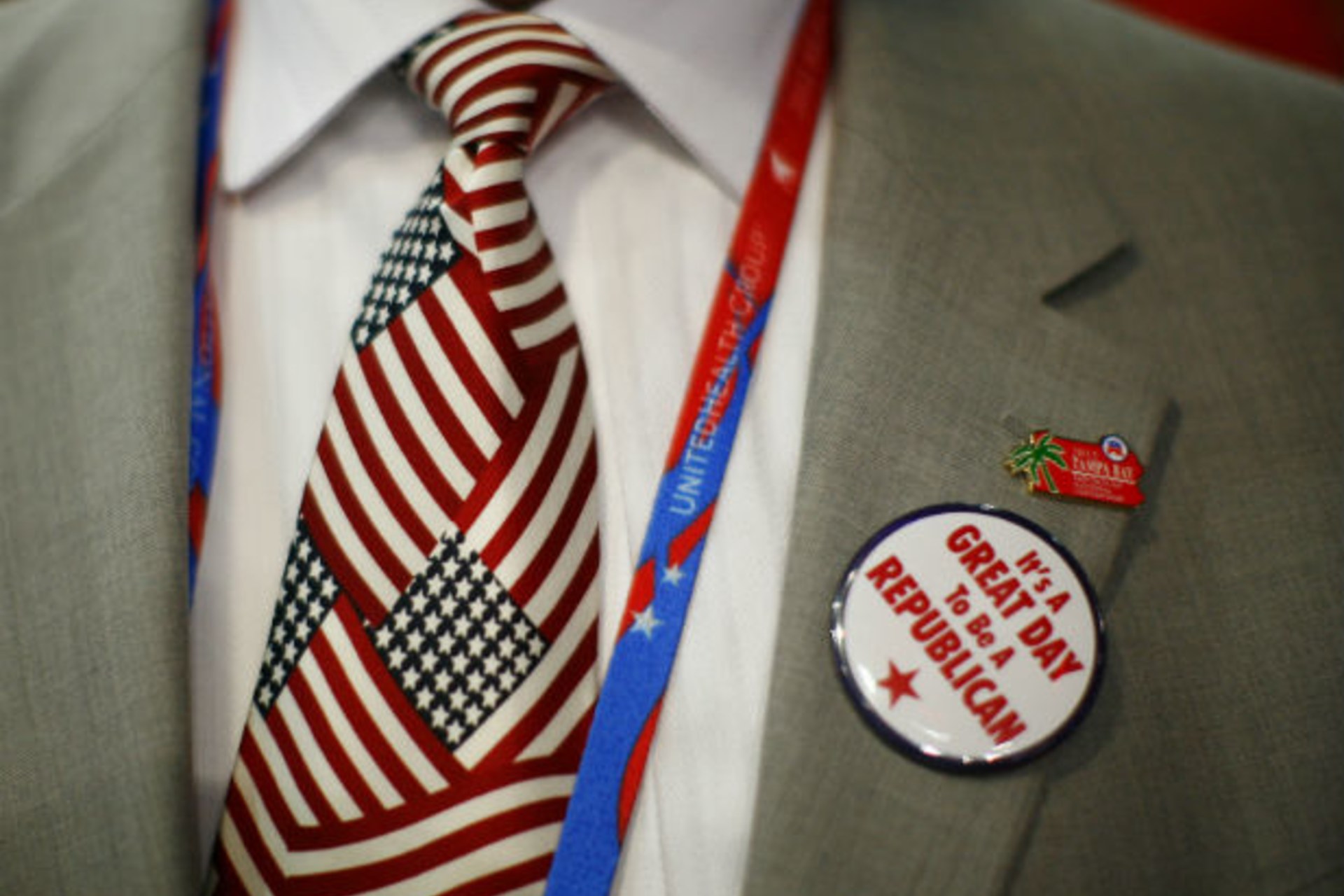 <p>A convention goer wears a button during the second day of the Republican National Convention in Tampa</p>
