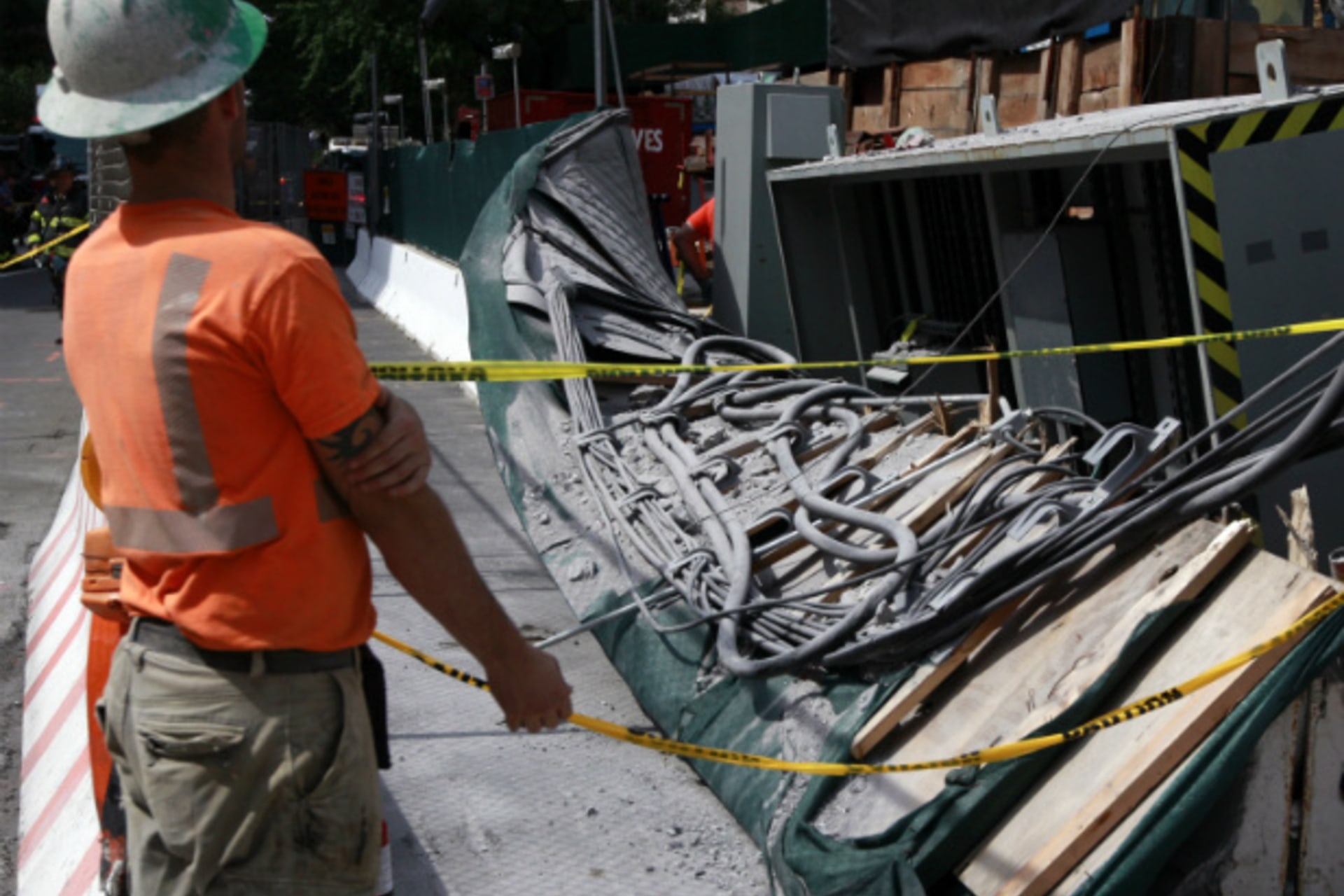 <p>Construction workers look over the damage following a blast at the 72nd Street construction site of the Second Avenue subway line in Manhattan on August 21, 2012 (Brendan McDermid/Courtesy Reuters).</p>