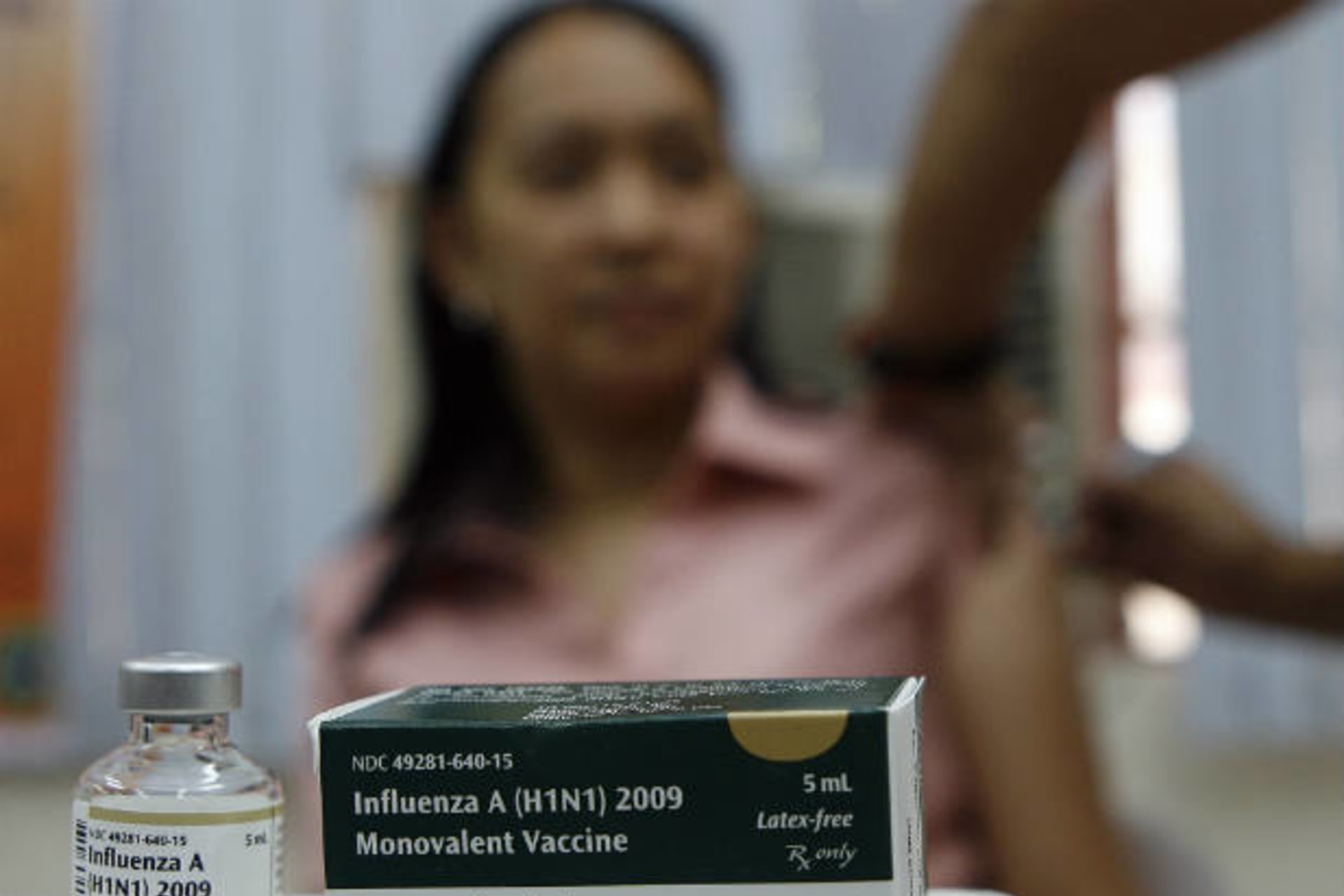 <p>A health worker gets a single dose of influenza vaccine in Mandaluyong City in the Philippines on April 26, 2010. At least 1.9…ganization (WHO) will be used to vaccinate more than 36,000 health workers, as part of the country’s response to the pandemic.</p>
