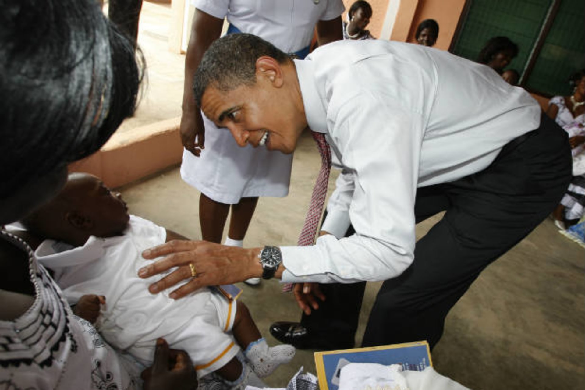 <p>President Barack Obama greets a baby as he visits a hospital in Accra, Ghana on July 11, 2009 (Jason Reed/Courtesy Reuters).</p>