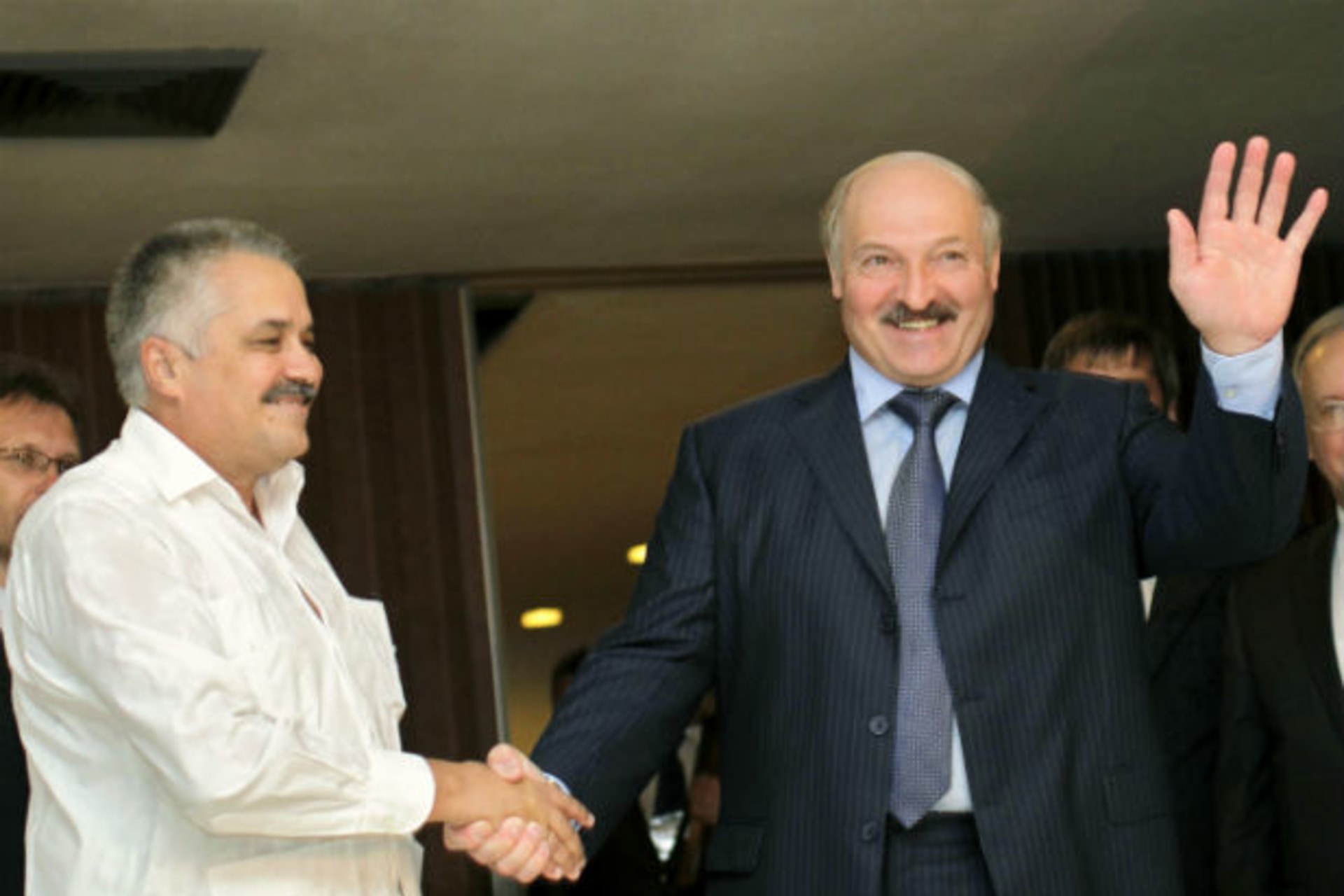 Belarussian president Alexander Lukashenko shakes hands with Cuban vice minister of foreign affairs Dagoberto Rodriguez at Havana's Jose Marti airport on June 24, 2012 (Enrique de la Osa/Courtesy Reuters).
